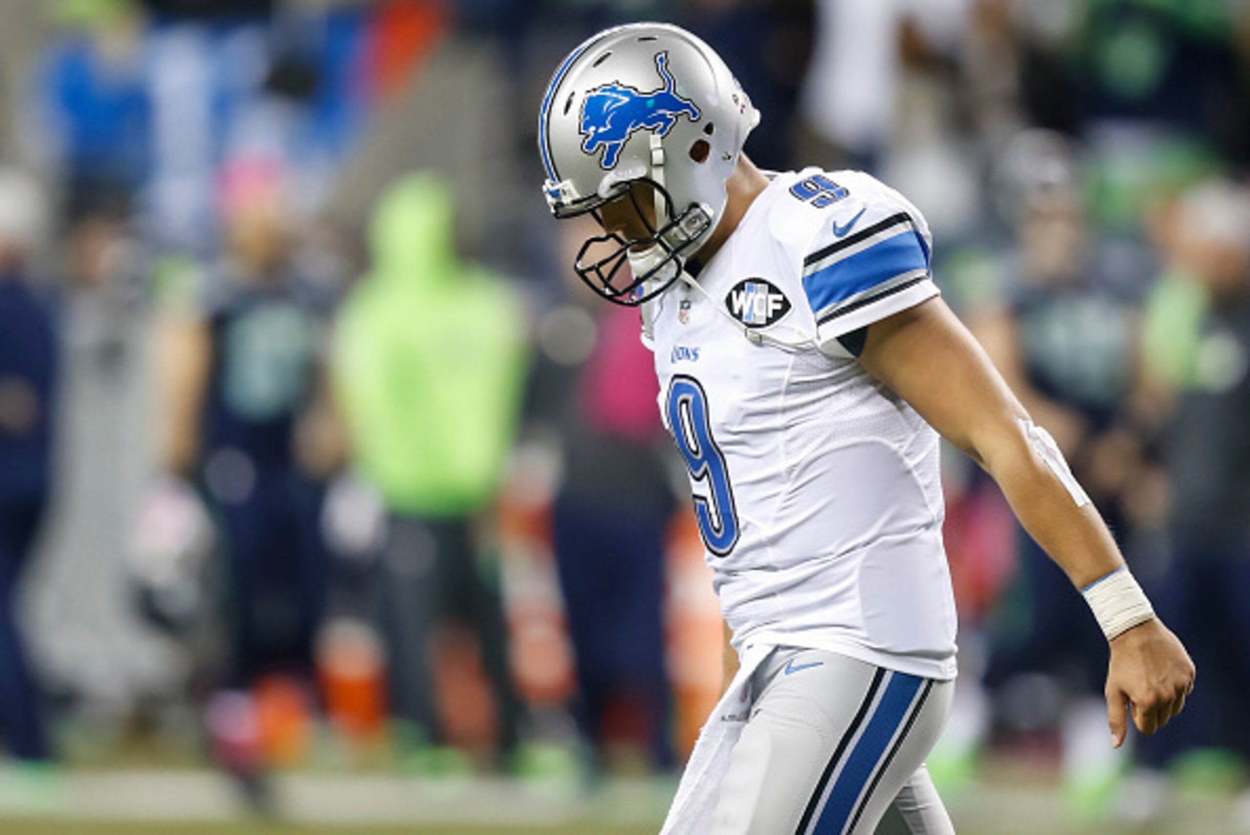 SEATTLE, WA - OCTOBER 5: quarterback Matthew Stafford #9 of the Detroit Lions walks off the field after teammate Calvin Johnson #81 fumbled near goal line late during the second half of a football game at CenturyLink Field on October 5, 2015 in Seattle, W