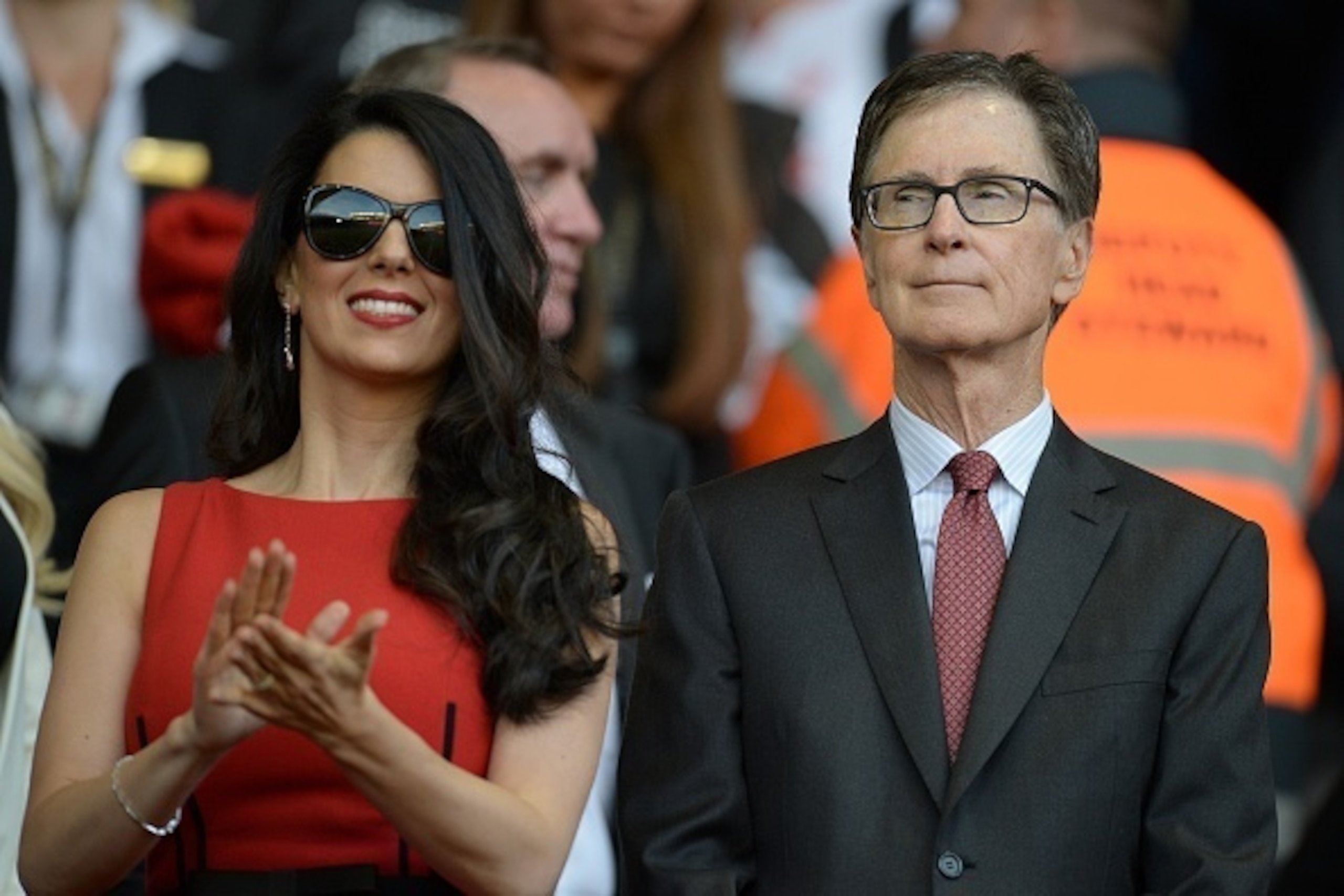 Liverpool's US owner John W. Henry (R) and his wife Linda Pizzuti are pictured before the start of the English Premier League football match between Liverpool and Bournemouth at the Anfield stadium in Liverpool, north-west England on August 17, 2015.  AFP