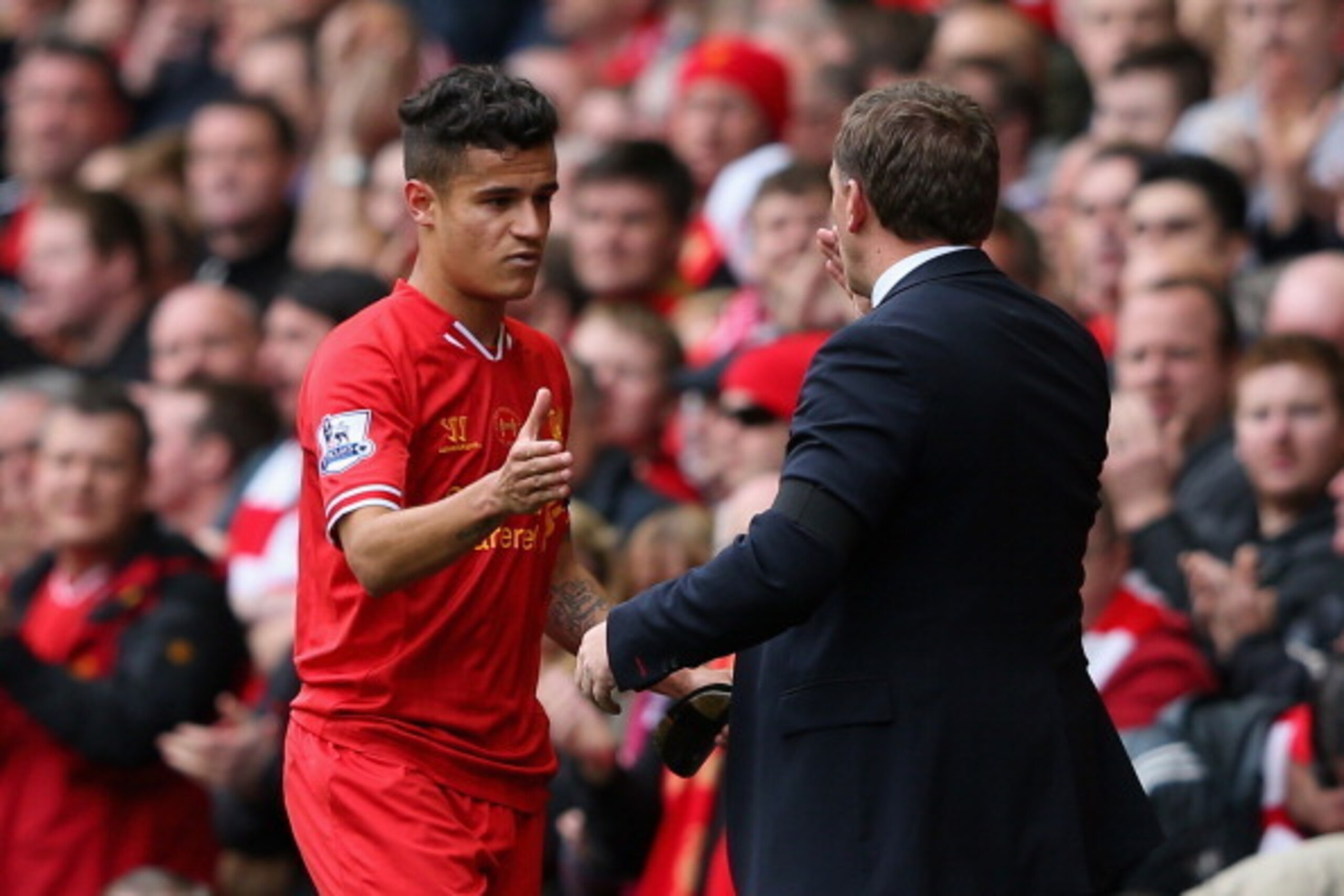 LIVERPOOL, ENGLAND - APRIL 13:  Liverpool Manager Brendan Rodgers congratulates Philippe Coutinho as he is substituted during the Barclays Premier League match between Liverpool and Manchester City at Anfield on April 13, 2014 in Liverpool, England.  (Pho