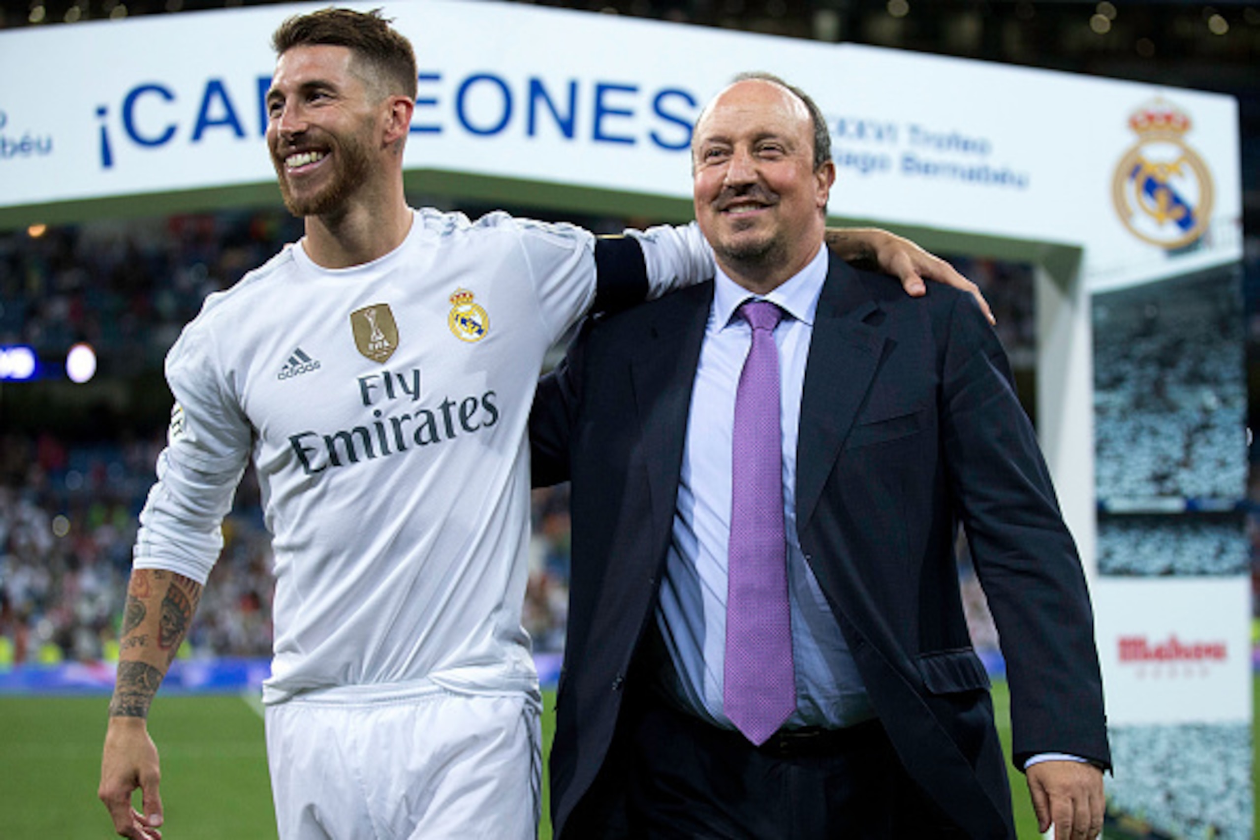 MADRID, SPAIN - AUGUST 18: Captain Sergio Ramos (L) of Real Madrid CF embraces his head coach Rafael Benitez (L) after winning the Santiago Bernabeu Trophy match between Real Madrid CF and Galatasaray at Estadio Santiago Bernabeu on August 18, 2015 in Ma MADRID, SPAIN - AUGUST 18: Captain Sergio Ramos (L) of Real Madrid CF embraces his head coach Rafael Benitez (L) after winning the Santiago Bernabeu Trophy match between Real Madrid CF and Galatasaray at Estadio Santiago Bernabeu on August 18, 2015 in Ma