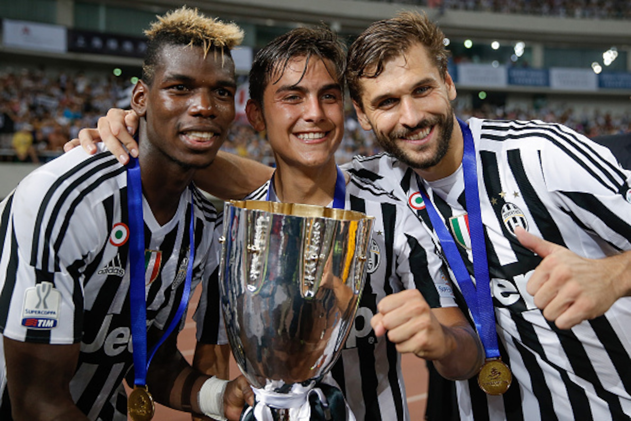 SHANGHAI, CHINA - AUGUST 08: (L-R) Paul Labile Pogba, Paulo Dybala and Fernando Llorente of Juventus celebrates with the trophy after winning the Italian Super Cup final football match between Juventus and Lazio at Shanghai Stadium on August 8, 2015 in S SHANGHAI, CHINA - AUGUST 08: (L-R) Paul Labile Pogba, Paulo Dybala and Fernando Llorente of Juventus celebrates with the trophy after winning the Italian Super Cup final football match between Juventus and Lazio at Shanghai Stadium on August 8, 2015 in S