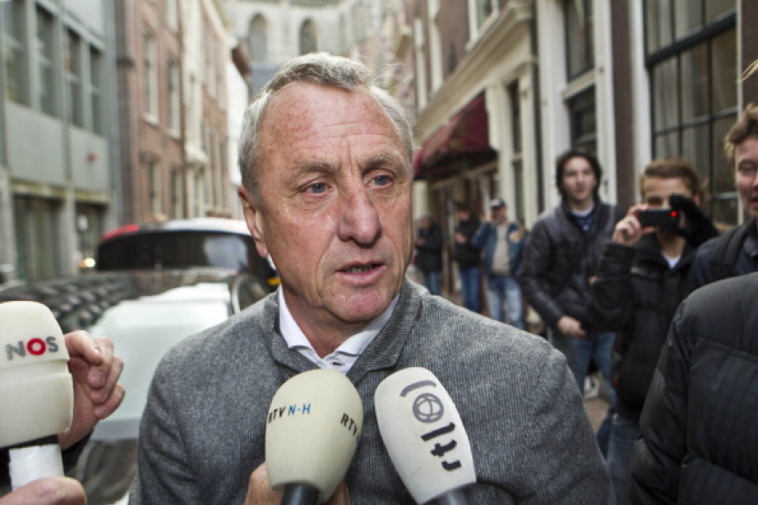 Johan Cruyff is surrounded by reporters as he arrives at court during his legal case to block the appointment of Louis van Gaal as the director of Ajax football club on December 7, 2011 in Haarlem, Netherlands. Cruyff's case is supported by Ajax coaching 