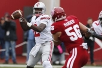 Oct 3, 2015; Bloomington, IN, USA; Ohio State Buckeyes quarterback Cardale Jones (12) throws a pass against the Indiana Hoosiers at Memorial Stadium. Mandatory Credit: Brian Spurlock-USA TODAY Sports