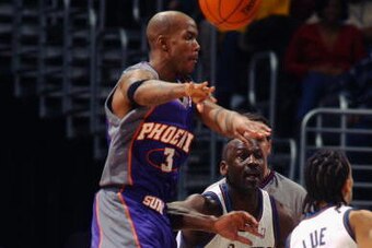 WASHINGTON - JANUARY 27:  Stephon Marbury #3 of the Phoenix Suns passes the ball while being guarded by Michael Jordan #23 of the Washington Wizards during the game at MCI Center on January 27, 2003 in Washington, D.C.  The Wizards won 98-93.  NOTE TO USE