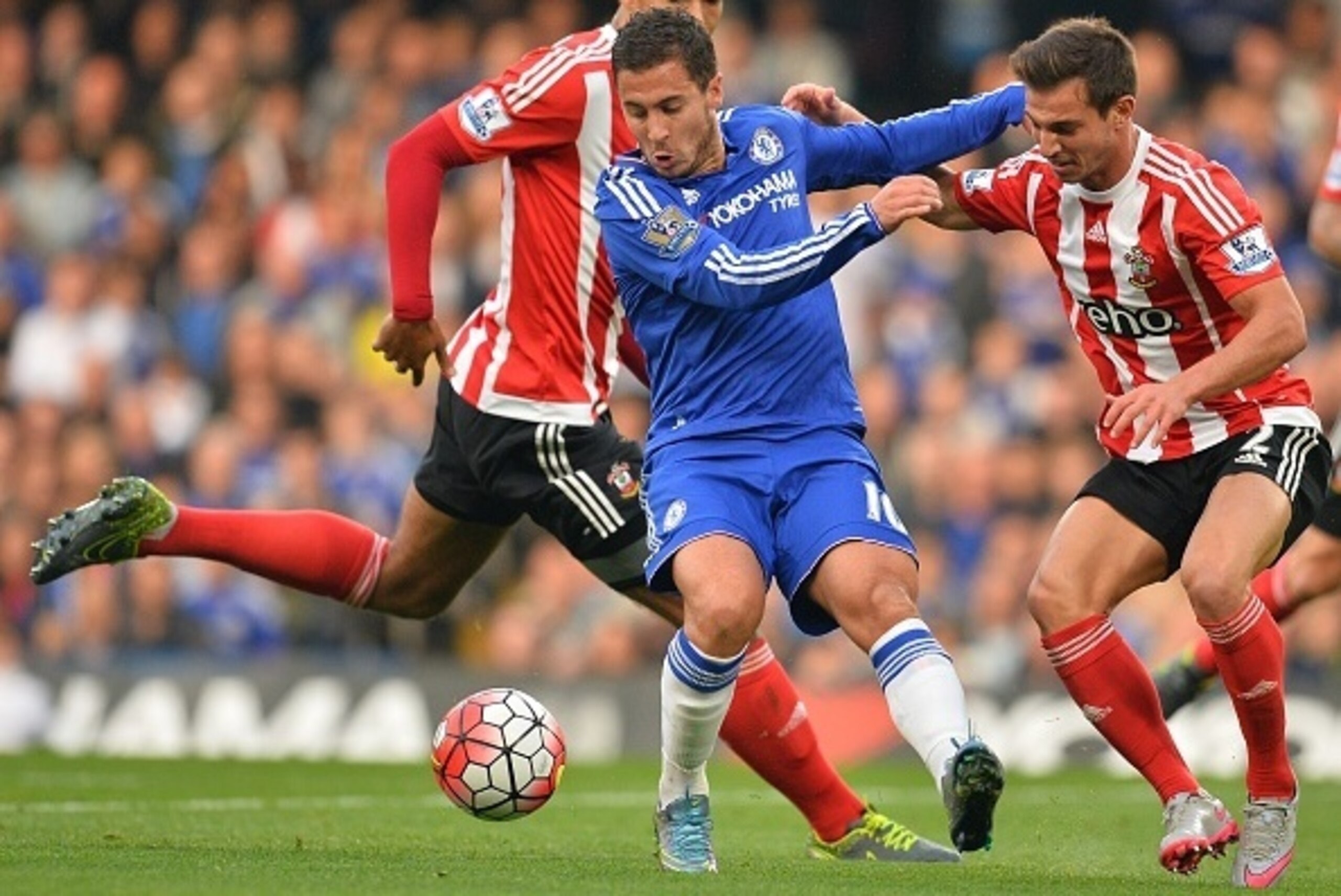 Chelsea's Belgian midfielder Eden Hazard (2nd L) vies with Southampton's German-born Portuguese defender Cedric Soares (R) during the English Premier League football match between Chelsea and Southampton at Stamford Bridge in London on October 3, 2015. AF Chelsea's Belgian midfielder Eden Hazard (2nd L) vies with Southampton's German-born Portuguese defender Cedric Soares (R) during the English Premier League football match between Chelsea and Southampton at Stamford Bridge in London on October 3, 2015. AF