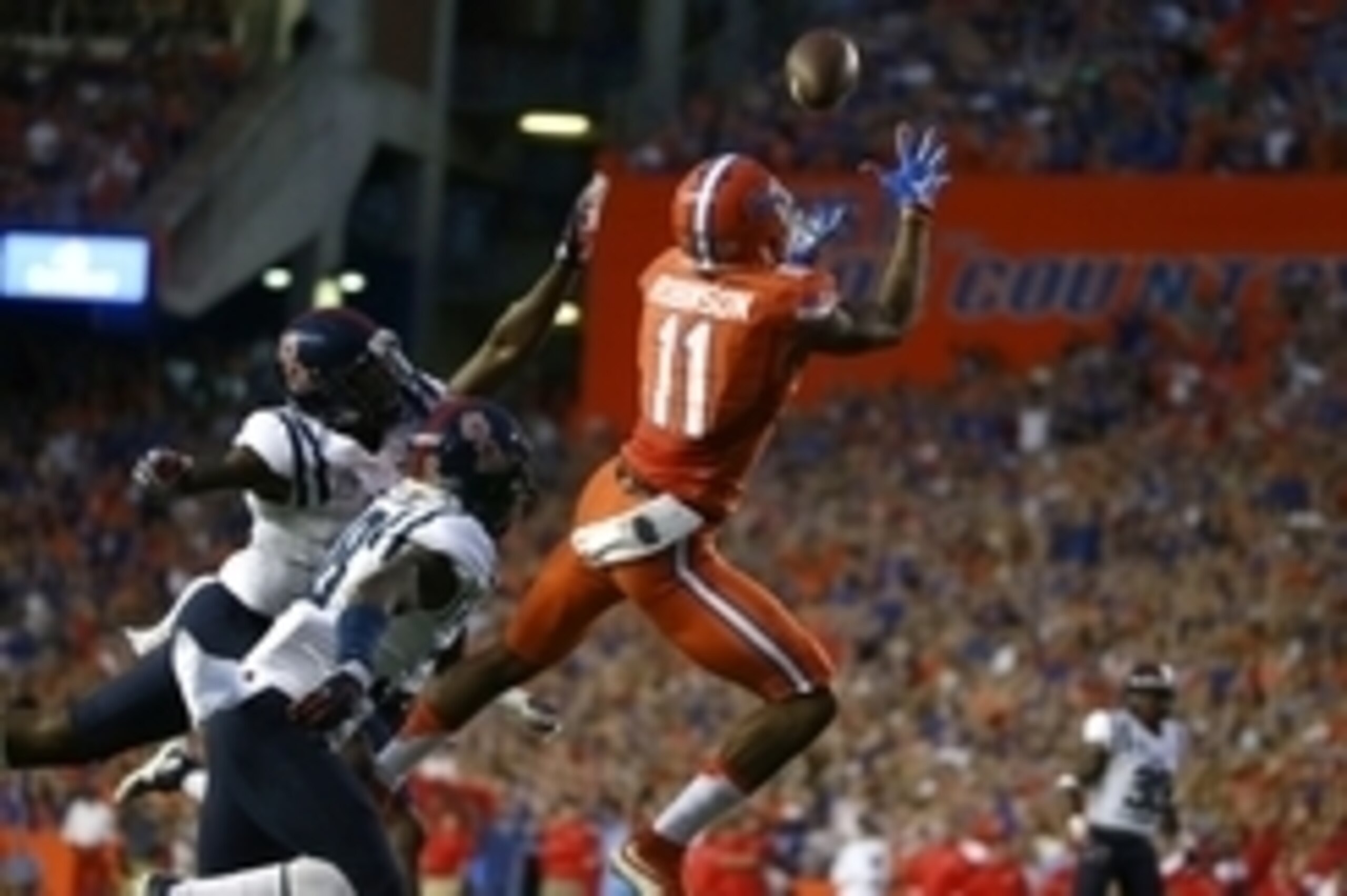 Oct 3, 2015; Gainesville, FL, USA; Florida Gators wide receiver Demarcus Robinson (11) catches the ball for a touchdown over Mississippi Rebels defensive back Mike Hilton (38) during the first quarter at Ben Hill Griffin Stadium. Mandatory Credit: Kim Kle
