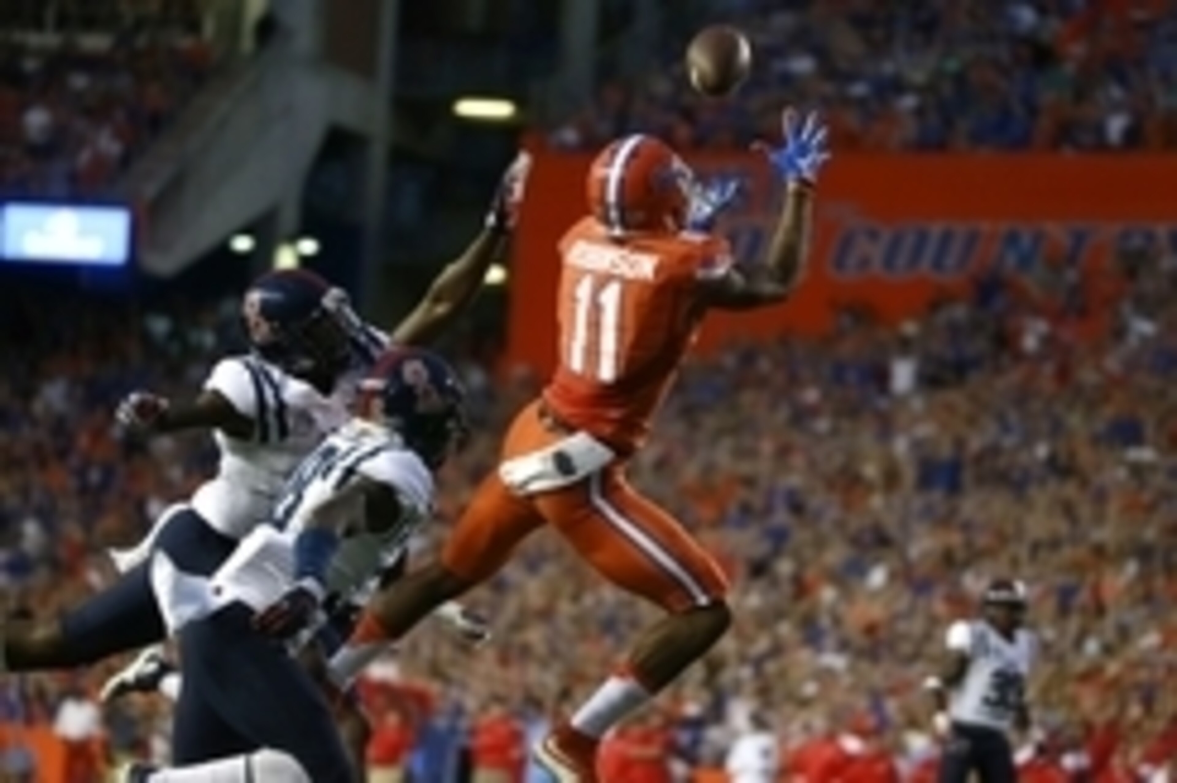 Oct 3, 2015; Gainesville, FL, USA; Florida Gators wide receiver Demarcus Robinson (11) catches the ball for a touchdown over Mississippi Rebels defensive back Mike Hilton (38) during the first quarter at Ben Hill Griffin Stadium. Mandatory Credit: Kim Kle