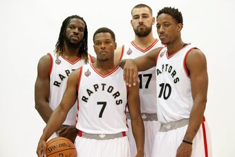 Sep 28, 2015; Toronto, Ontario, Canada; Toronto Raptors forward DeMarre Carroll (5) centre Jonas Valanciunas (17)  guard Kyle Lowry (7) and  guard DeMar DeRozan (10) during the media day at the Air Canada Centre. Mandatory Credit: Peter Llewellyn-USA TODA