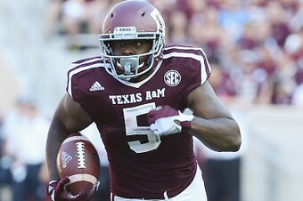 COLLEGE STATION, TX - SEPTEMBER 12:   Tra Carson #5 of the Texas A&M Aggies runs with the ball in the first half of their game against the Ball State Cardinals at Kyle Field on September 12, 2015 in College Station, Texas.  (Photo by Scott Halleran/Getty 
