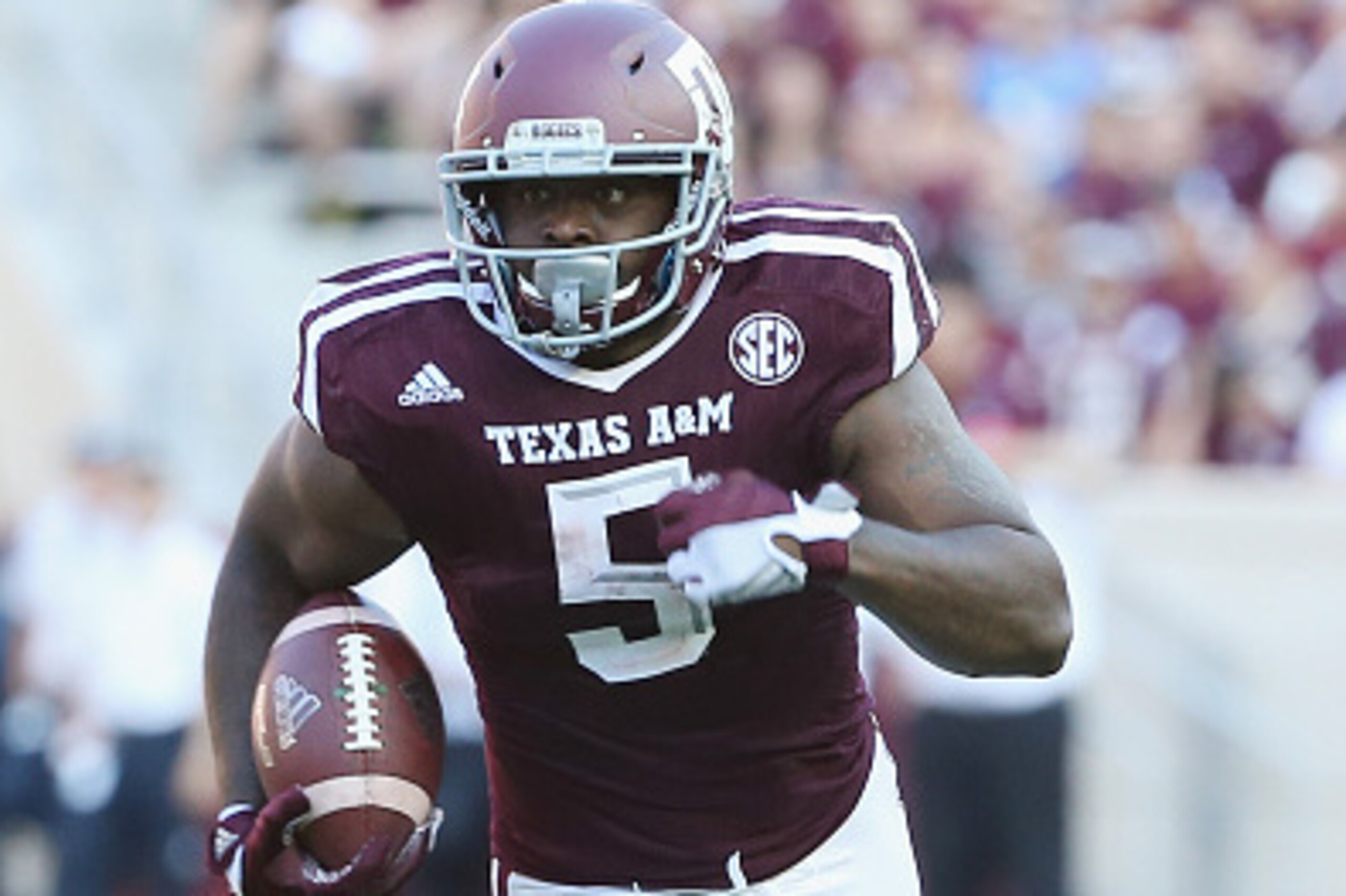 COLLEGE STATION, TX - SEPTEMBER 12:   Tra Carson #5 of the Texas A&M Aggies runs with the ball in the first half of their game against the Ball State Cardinals at Kyle Field on September 12, 2015 in College Station, Texas.  (Photo by Scott Halleran/Getty 