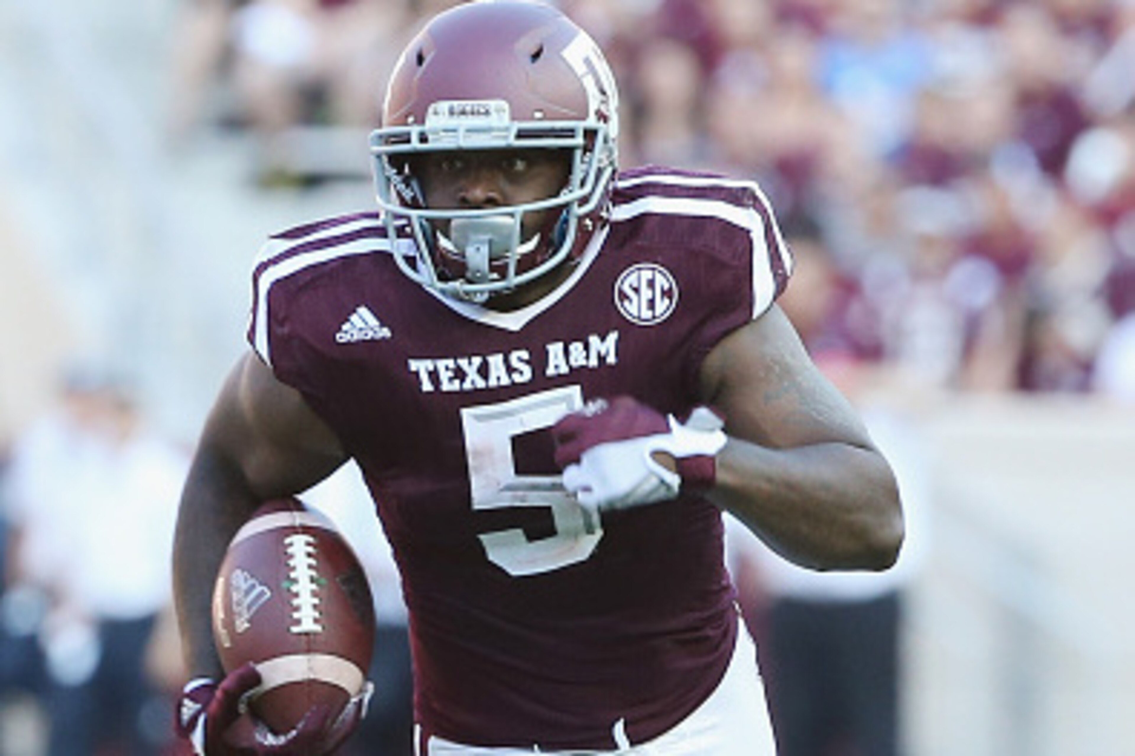 COLLEGE STATION, TX - SEPTEMBER 12:   Tra Carson #5 of the Texas A&M Aggies runs with the ball in the first half of their game against the Ball State Cardinals at Kyle Field on September 12, 2015 in College Station, Texas.  (Photo by Scott Halleran/Getty 