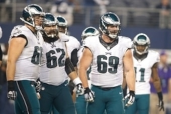 Nov 27, 2014; Arlington, TX, USA; Philadelphia Eagles tackle Andrew Gardner (66) and center Jason Kelce (62) and guard Evan Mathis (69) in the huddle during the game against the Dallas Cowboys at AT&T Stadium. Philadelphia beat Dallas 33-10. Mandatory Cre