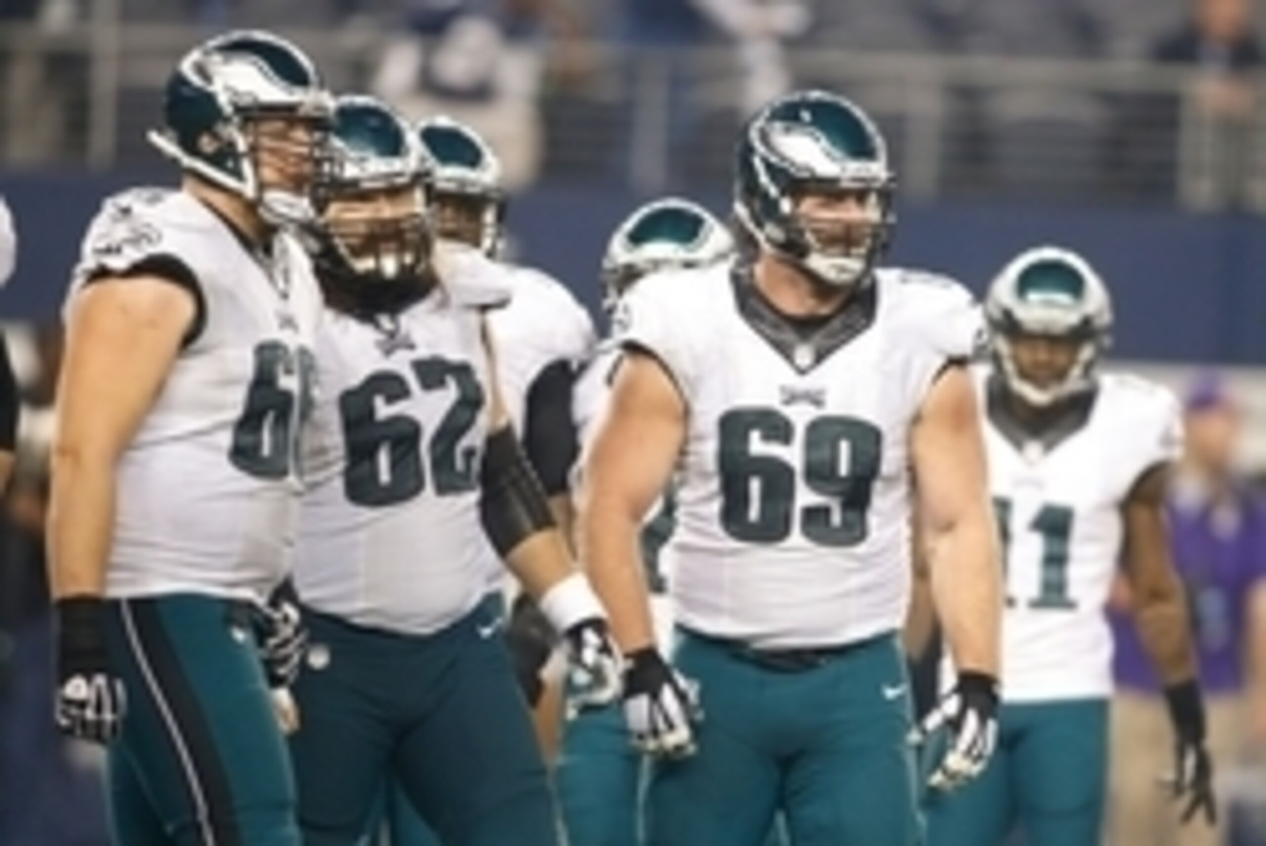Nov 27, 2014; Arlington, TX, USA; Philadelphia Eagles tackle Andrew Gardner (66) and center Jason Kelce (62) and guard Evan Mathis (69) in the huddle during the game against the Dallas Cowboys at AT&T Stadium. Philadelphia beat Dallas 33-10. Mandatory Cre
