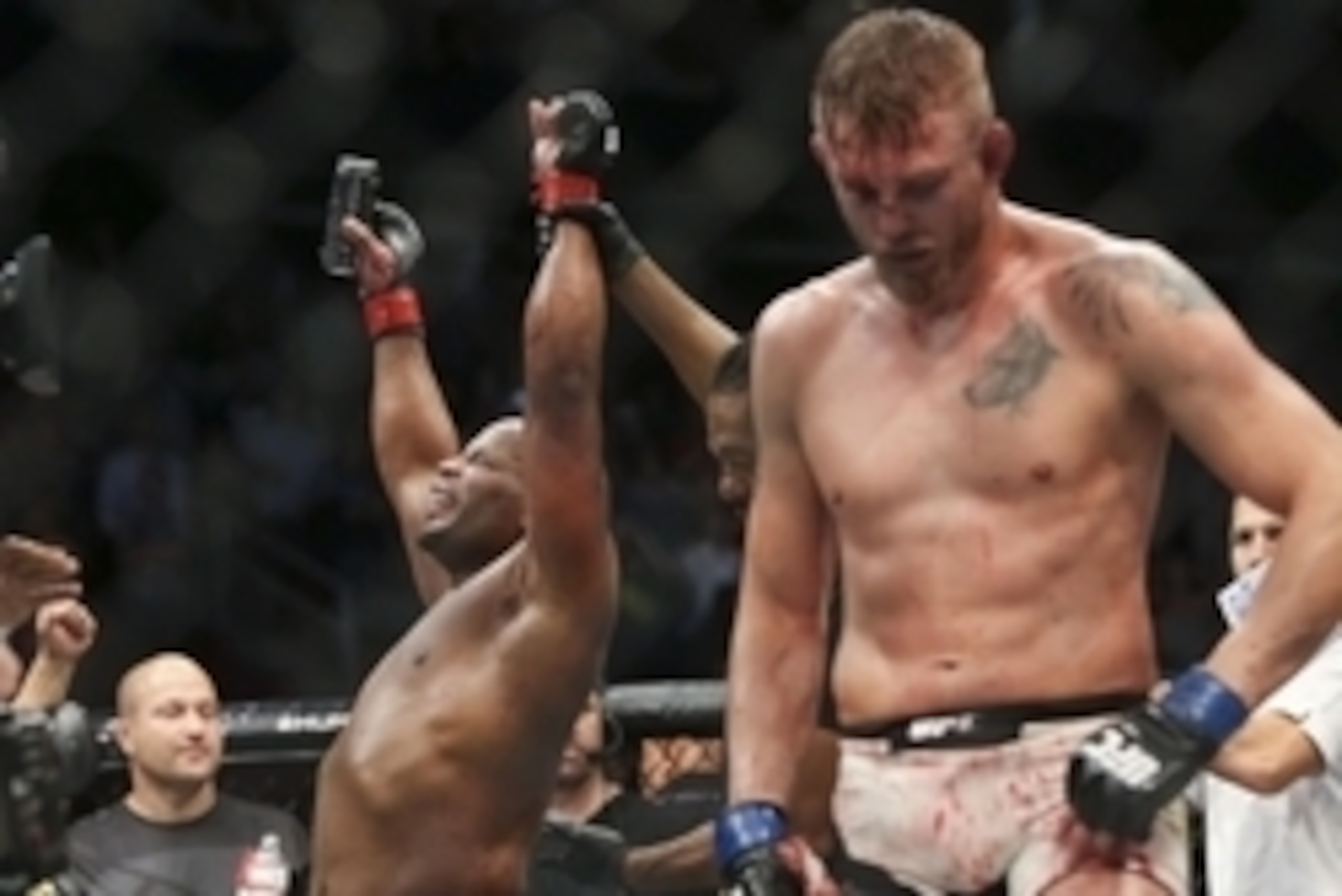 Oct 3, 2015; Houston, TX, USA; Daniel Cormier (red gloves) celebrates after defeating Alexander Gustafsson (blue gloves) after their World Light Heavyweight Championship at UFC 192 at Toyota Center. Mandatory Credit: Troy Taormina-USA TODAY Sports