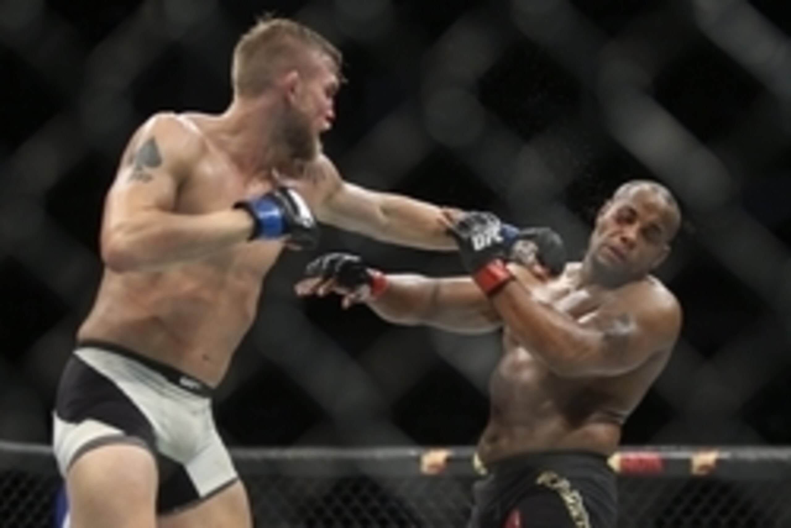 Oct 3, 2015; Houston, TX, USA; Daniel Cormier (red gloves) competes against Alexander Gustafsson (blue gloves) during their World Light Heavyweight Championship at UFC 192 at Toyota Center. Mandatory Credit: Troy Taormina-USA TODAY Sports