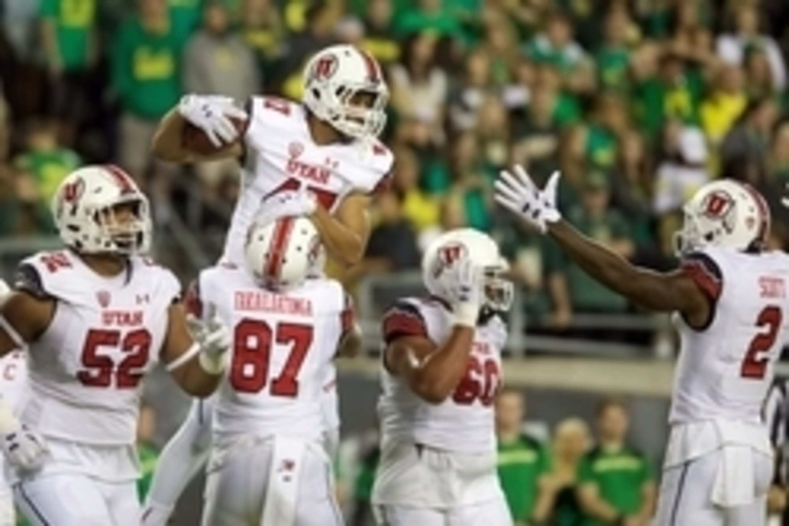Sep 26, 2015; Eugene, OR, USA; Utah Utes tight end Caleb Repp (47) celebrates a touchdown with offensive tackle Sam Tevi (52) and tight end Siale Fakailoatonga (87) and offensive lineman Siaosi Aiono (60) and wide receiver Kenneth Scott (2) against the Or