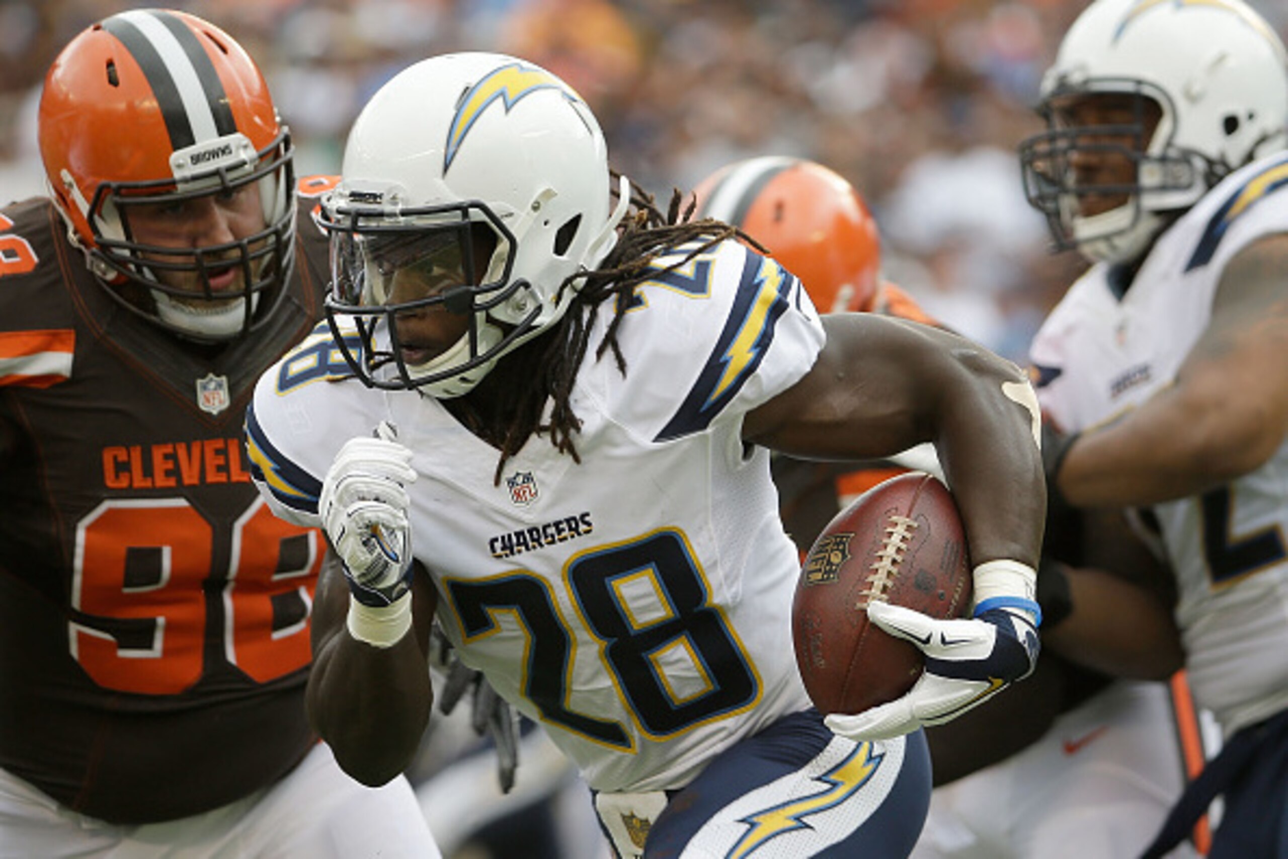 SAN DIEGO, CA - OCTOBER 04:  Melvin Gordon #28 of the San Diego Chargers carries the ball, while pursued by Jamie Meder #98 of the Cleveland Browns in the first half at Qualcomm Stadium on October 4, 2015 in San Diego, California. The Chargers defeated th