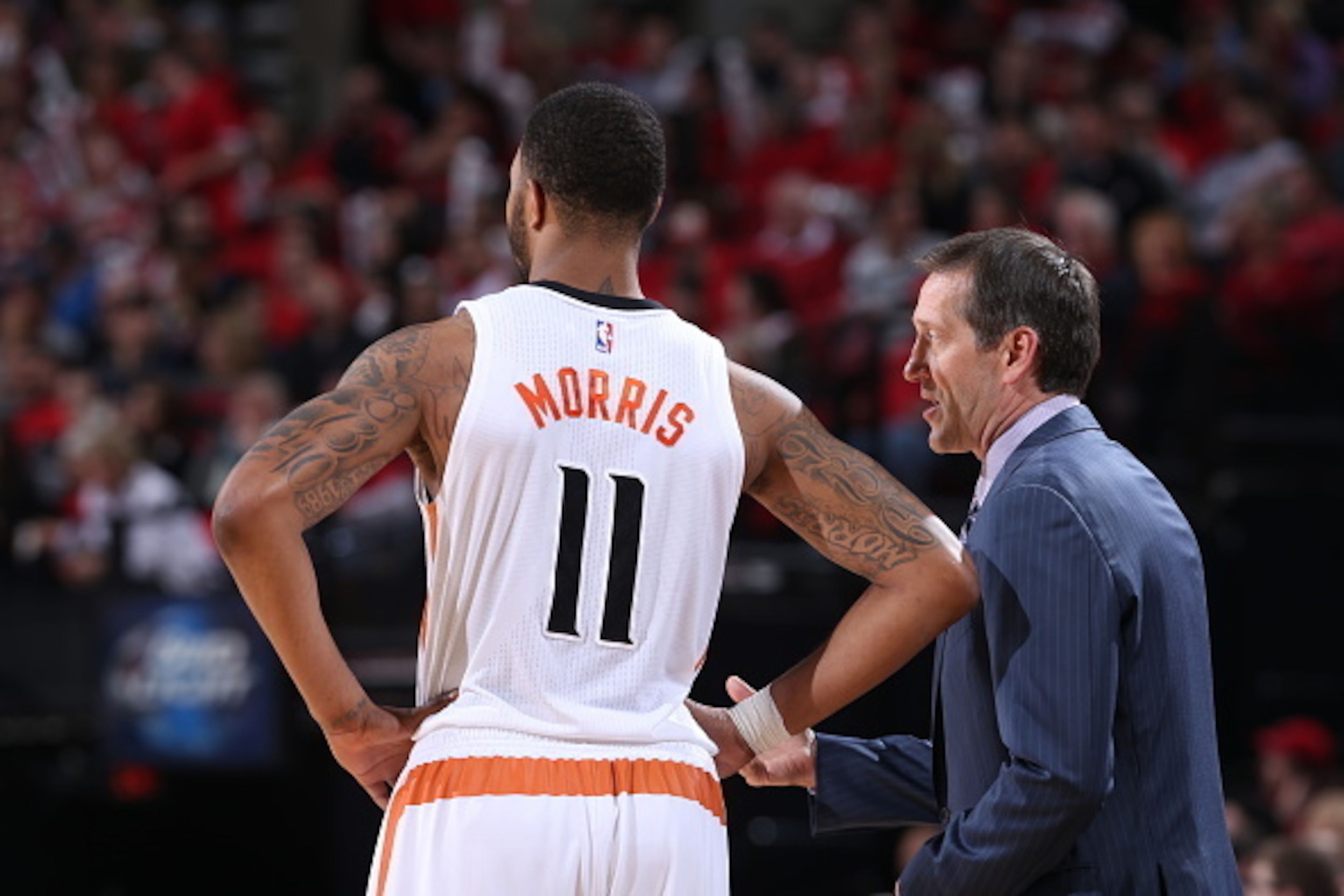 PORTLAND, OR - FEBRUARY 5: Markieff Morris #11 and Jeff Hornacek of the Phoenix Suns speak during a game against the Portland Trail Blazers on February 5, 2015 at the Moda Center Arena in Portland, Oregon. NOTE TO USER: User expressly acknowledges and agr