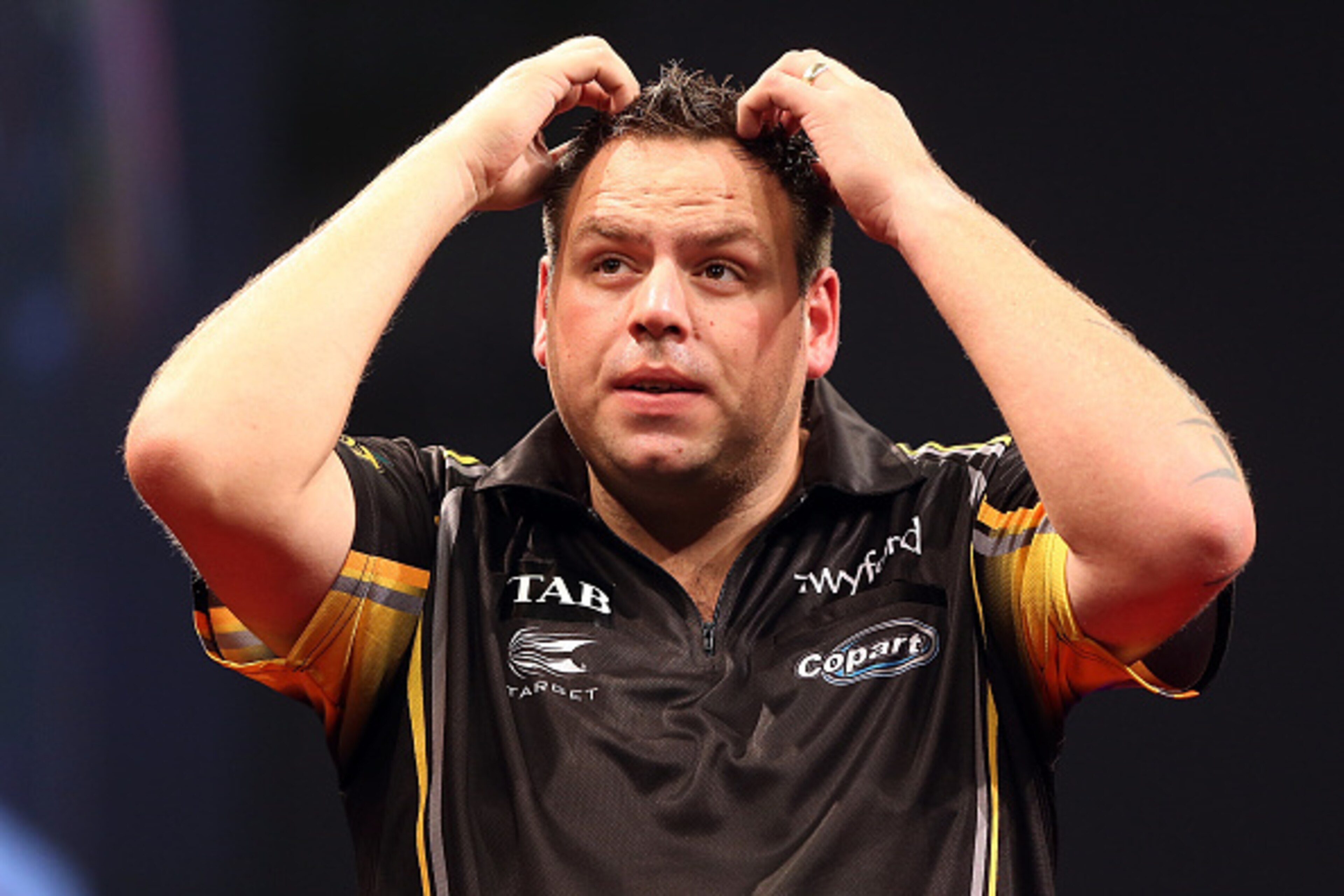 AUCKLAND, NEW ZEALAND - AUGUST 30: Adrian Lewis reacts during the final against Raymond van Barneveld during the Auckland Darts Masters at The Trusts Arena on August 30, 2015 in Auckland, New Zealand. (Photo by Michael Bradley/Getty Images) AUCKLAND, NEW ZEALAND - AUGUST 30: Adrian Lewis reacts during the final against Raymond van Barneveld during the Auckland Darts Masters at The Trusts Arena on August 30, 2015 in Auckland, New Zealand. (Photo by Michael Bradley/Getty Images)