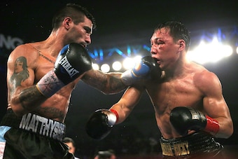 VERONA , NY - APRIL 18: Lucas Matthysse (L) catches the face of Ruslan Provodnikov with a left hook during their fight at the Turning Stone Resort Casino on April 18, 2015 in Verona, New York.  Matthysee won the 12 round bout by scores of 114-114, 115-113