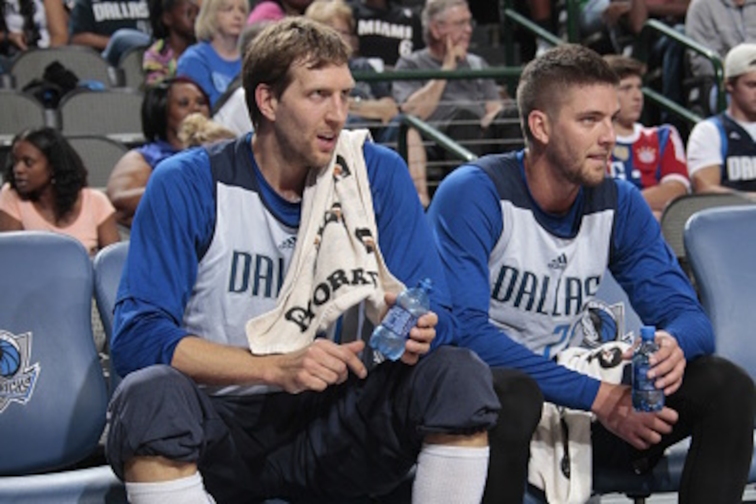 DALLAS, TX - OCTOBER 4: Dirk Nowitzki #41 and Chandler Parsons #25 of the Dallas Mavericks sit on the bench during the Dallas Mavericks 'Fan Jam' on October 4, 2014 at the American Airlines Center in Dallas, Texas. NOTE TO USER: User expressly acknowledge