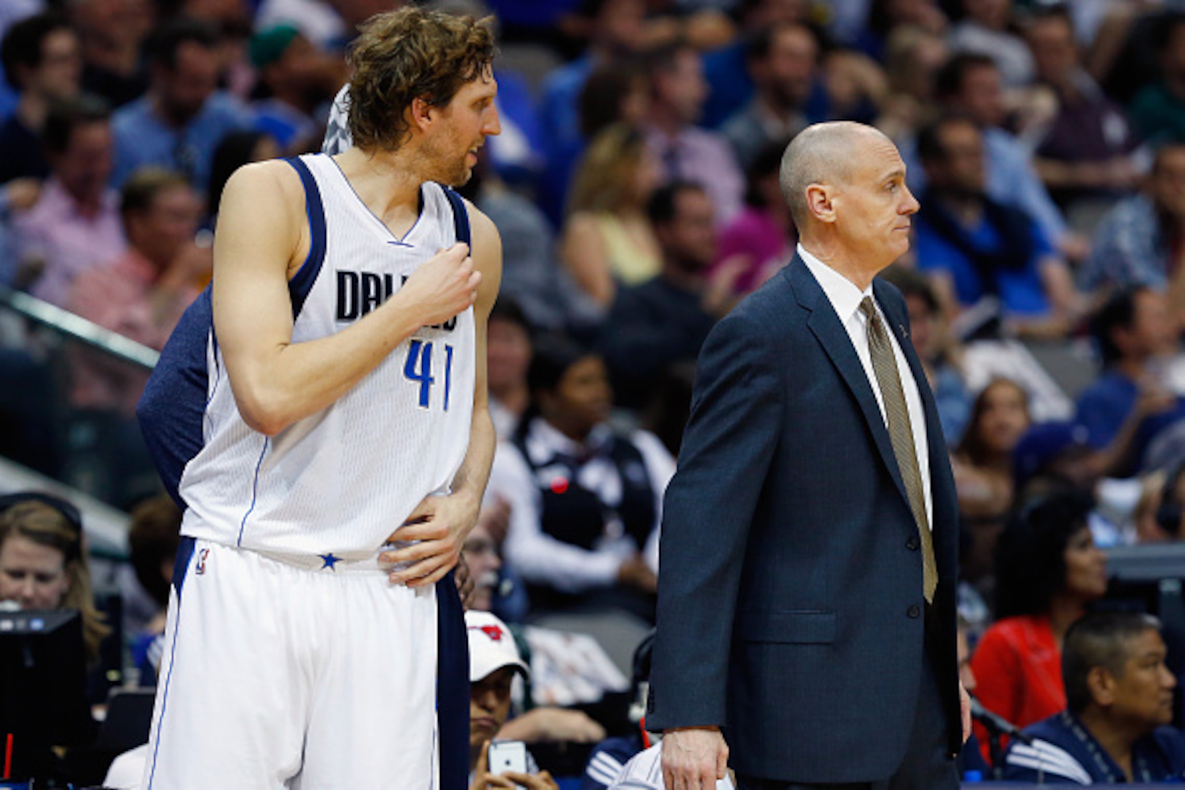 DALLAS, TX - APRIL 08:  Dirk Nowitzki #41 of the Dallas Mavericks and head coach Rick Carlisle of the Dallas Mavericks interact in the first half as the Mavericks take on the Phoenix Suns at American Airlines Center on April 8, 2015 in Dallas, Texas. NOTE
