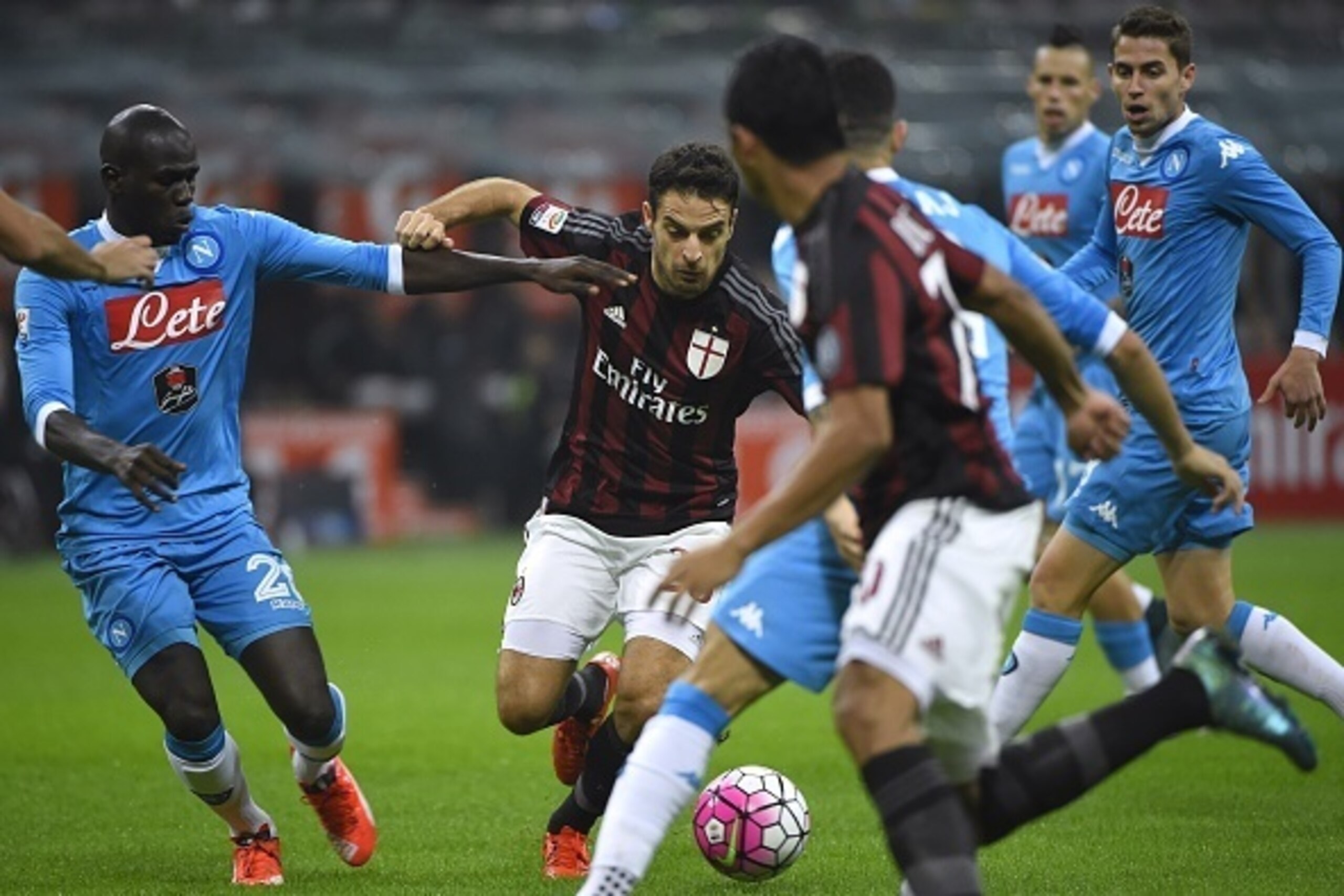 Napoli's French defender Kalidou Koulibaly (L) vies for the ball with AC Milan's midfielder Giacomo Bonaventura during the Italian Serie A football match between AC Milan and Napoli at San Siro Stadium in Milan on October 4, 2015. AFP PHOTO / OLIVIER MOR Napoli's French defender Kalidou Koulibaly (L) vies for the ball with AC Milan's midfielder Giacomo Bonaventura during the Italian Serie A football match between AC Milan and Napoli at San Siro Stadium in Milan on October 4, 2015. AFP PHOTO / OLIVIER MOR