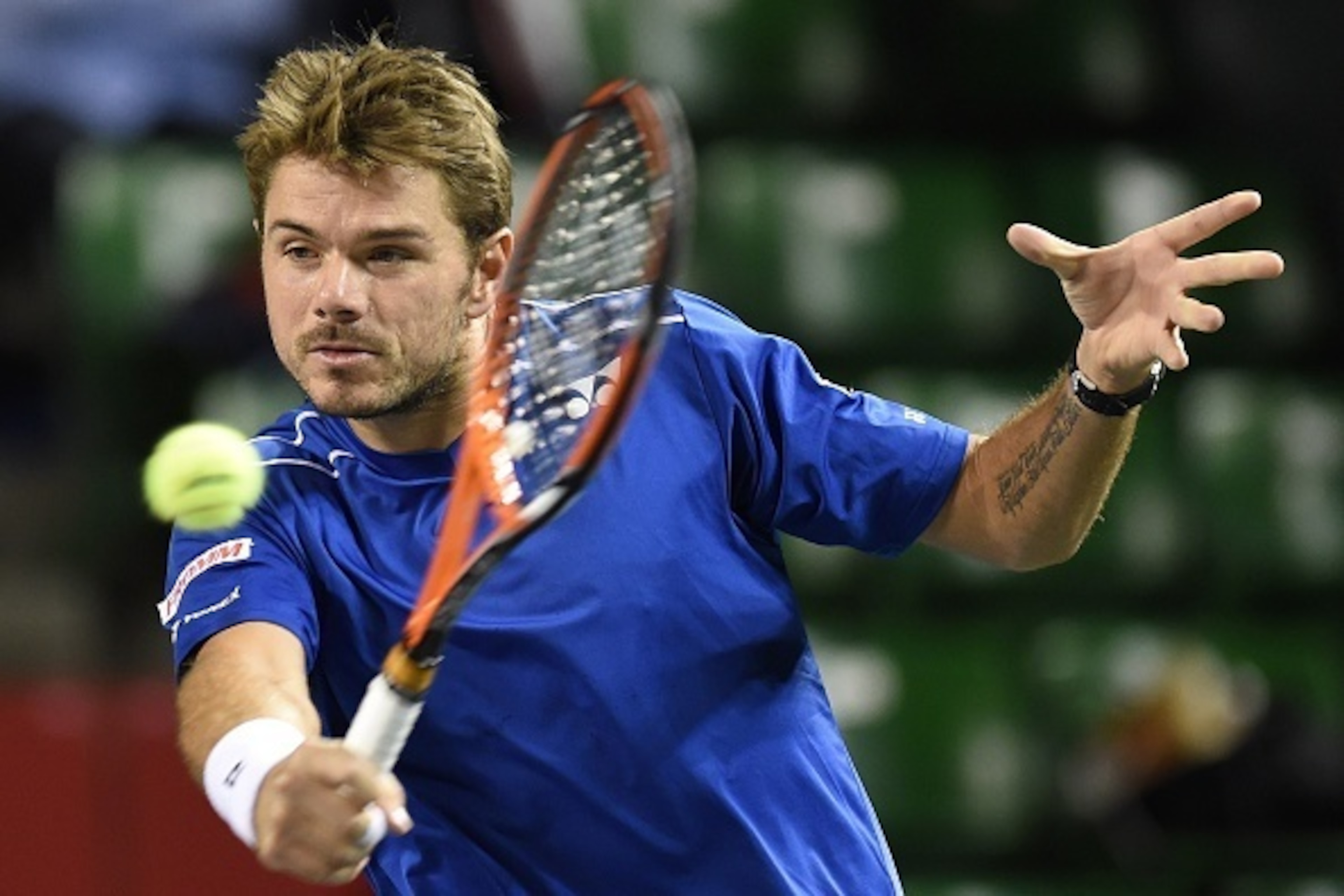 Stan Wawrinka of Switzerland returns the ball against Tatsuma Ito of Japan during their second round match in the Japan Open tennis tournament in Tokyo on October 7, 2015.      AFP PHOTO/Toru YAMANAKA        (Photo credit should read TORU YAMANAKA/AFP/Get