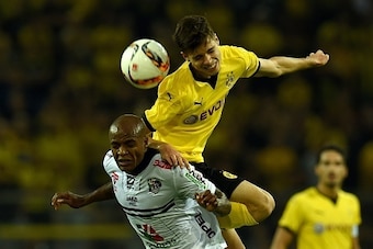 Dortmund's defender Julian Weigl and Wolfberg´s Brazilian forward Silvio (L) vie for the ball during the UEFA Europa League third qualifying round second leg football match between  Borussia Dortmund and Wolfsberger AC on August 6, 2015 in Dortmund, weste