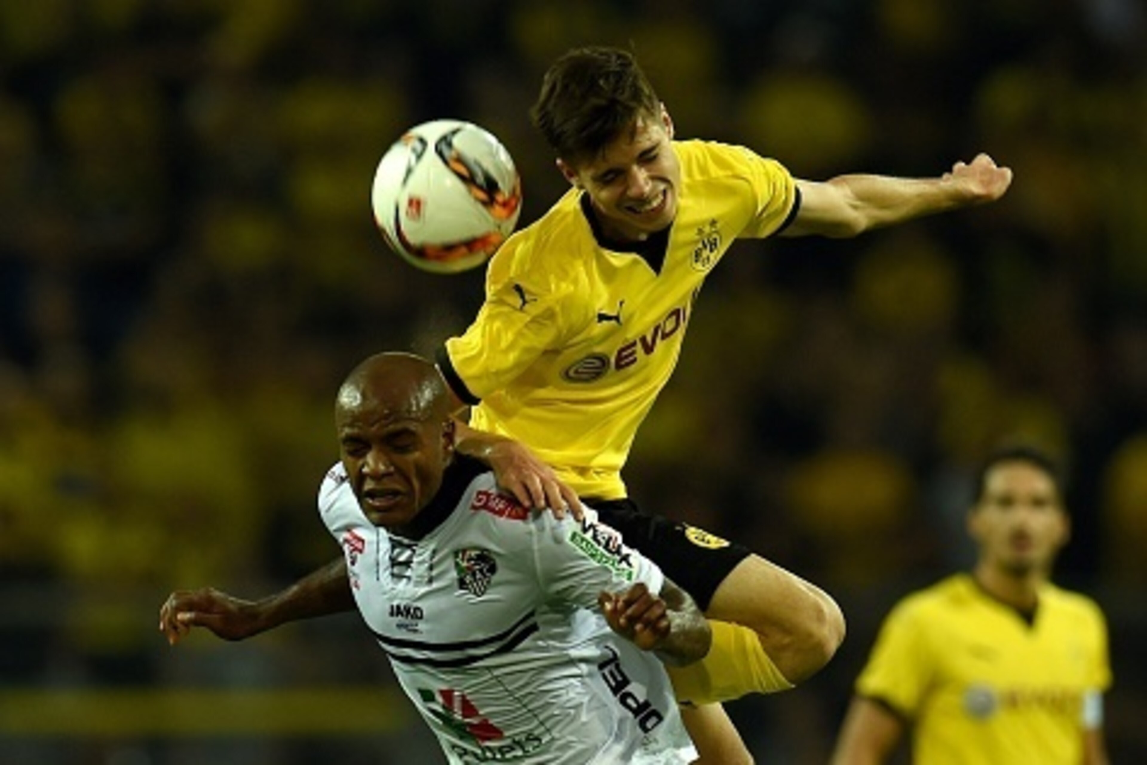 Dortmund's defender Julian Weigl and Wolfberg´s Brazilian forward Silvio (L) vie for the ball during the UEFA Europa League third qualifying round second leg football match between  Borussia Dortmund and Wolfsberger AC on August 6, 2015 in Dortmund, weste