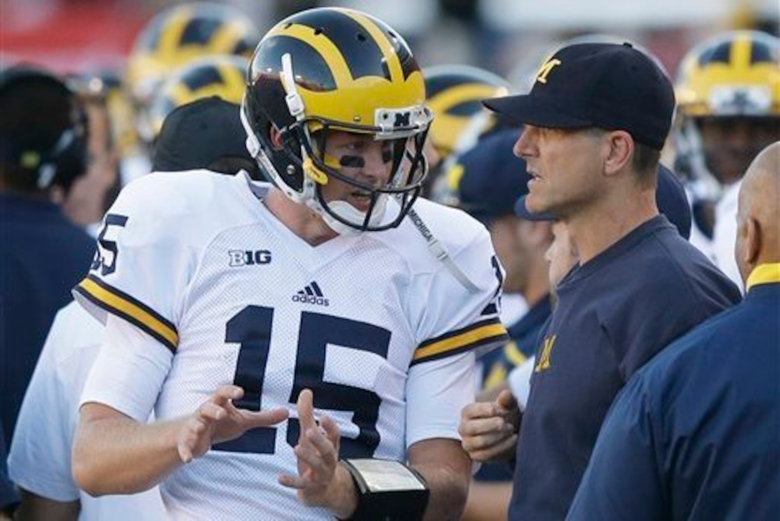 Behind a new quarterback and a new coach, Michigan's offense has a new edge. Behind a new quarterback and a new coach, Michigan's offense has a new edge.