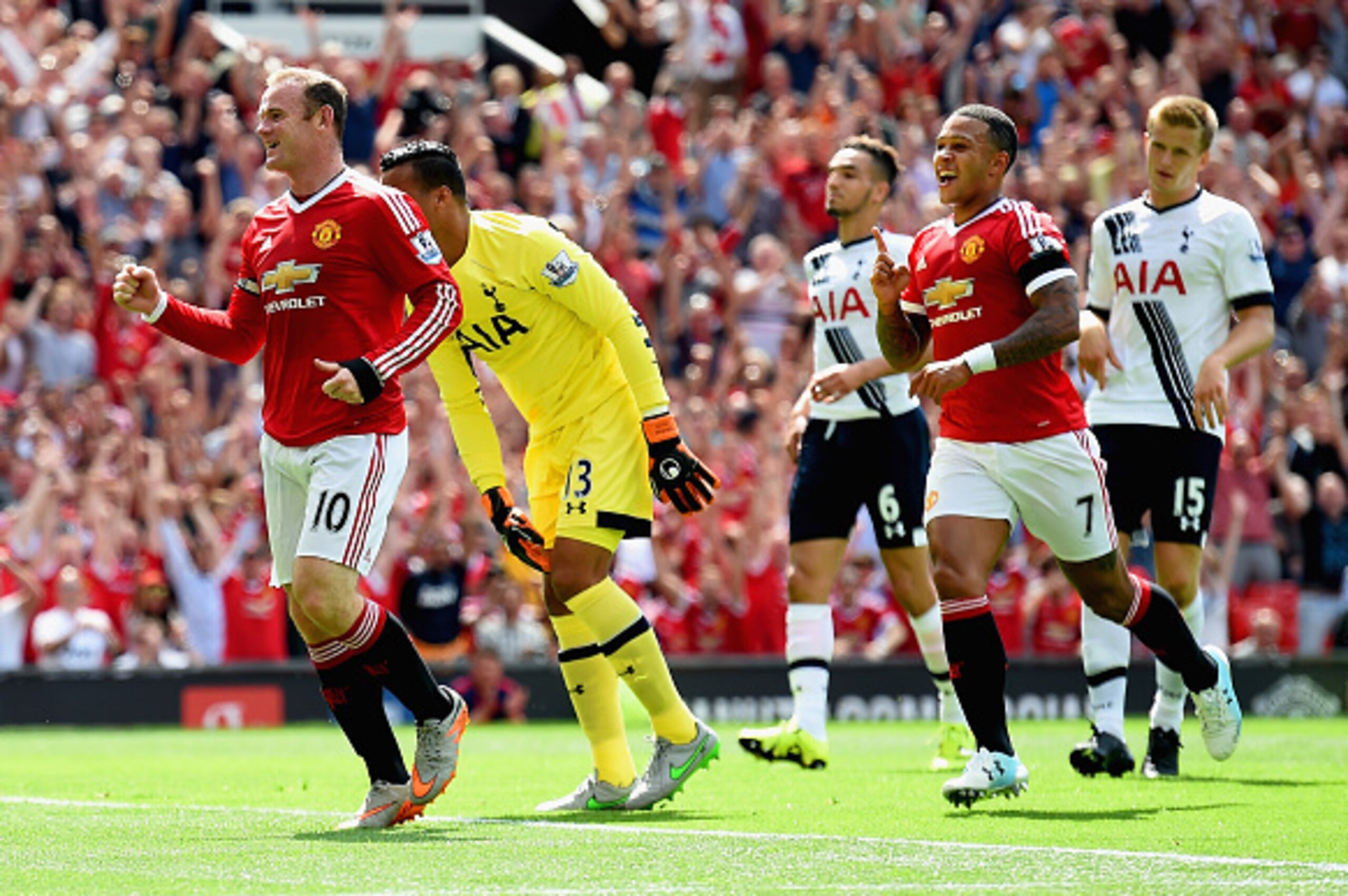MANCHESTER, ENGLAND - AUGUST 08: Wayne Rooney (1st L)of Manchester United celeberates his team's first goal during the Barclays Premier League match between Manchester United and Tottenham Hotspur at Old Trafford on August 8, 2015 in Manchester, England. 