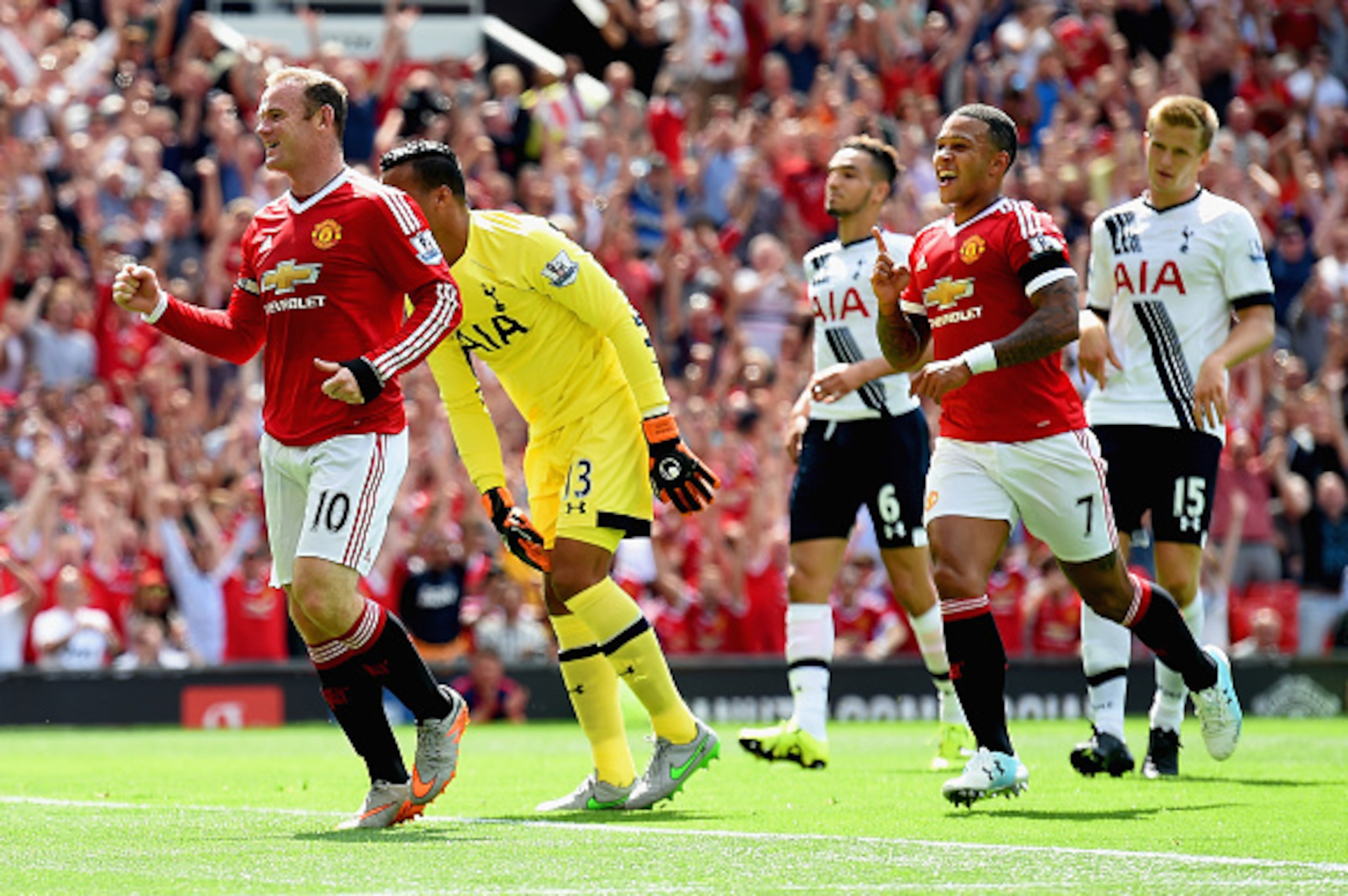 MANCHESTER, ENGLAND - AUGUST 08: Wayne Rooney (1st L)of Manchester United celeberates his team's first goal during the Barclays Premier League match between Manchester United and Tottenham Hotspur at Old Trafford on August 8, 2015 in Manchester, England. 