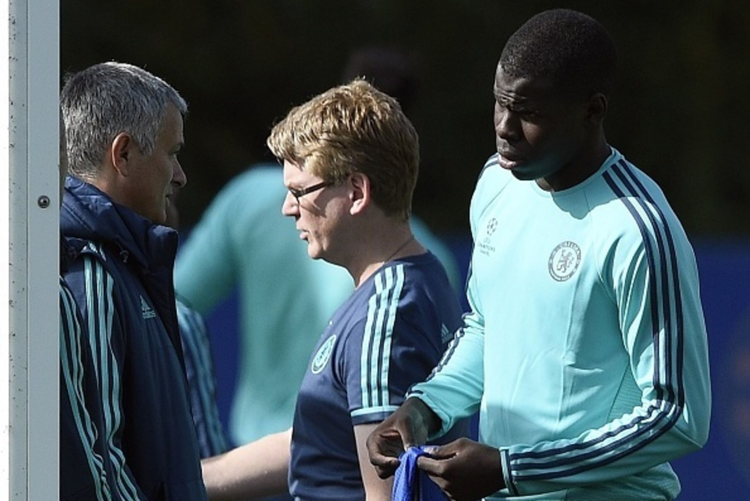 Chelsea's French defender Kurt Zouma (R) speaks with Chelsea's Portuguese manager Jose Mourinho (L) before a training session at Chelsea's training ground in Stoke D'Abernon, south of London, on September 28, 2015, on the eve of their UEFA Champions Leagu