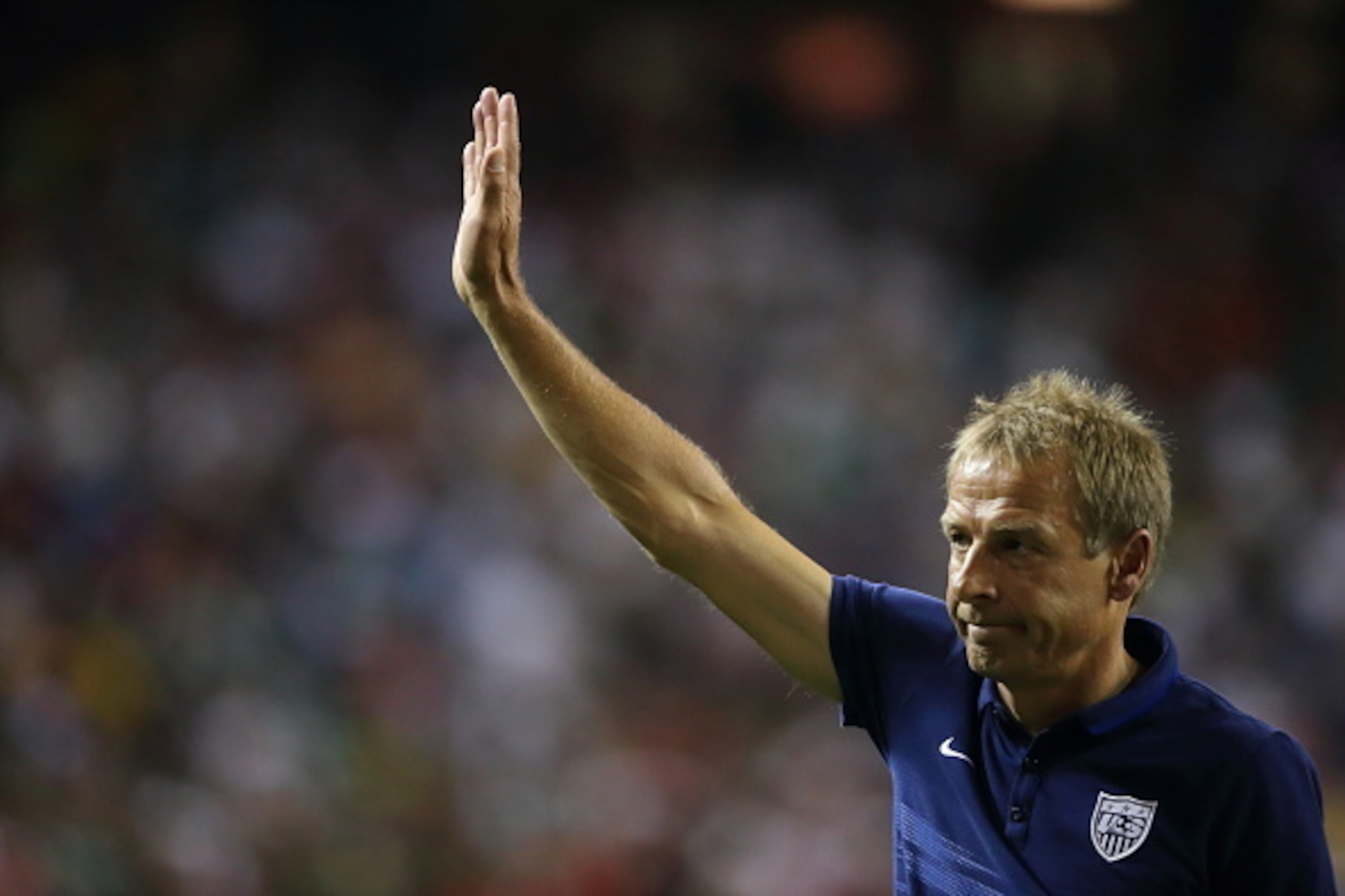 ATLANTA, GA - JULY 22:   Jurgen Klinsmann the head coach / manager of United States of America walks off the field waving to the crowd after losing in the 2015 CONCACAF Gold Cup Semifinal between USA and Jamaica at Georgia Dome on July 22, 2015 in Atlanta