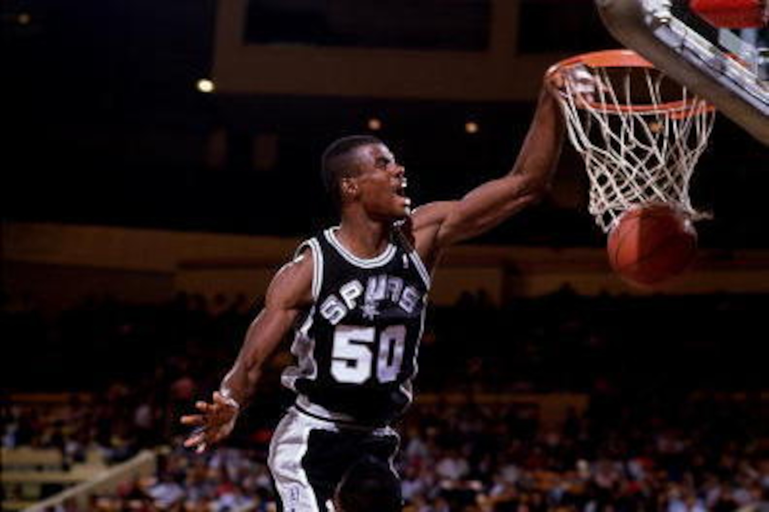 NEW YORK - 1989:  David Robinson #50 of the San Antonio Spurs goes up for a slam dunk against the New York Knicks during an NBA game in 1989 at Madison Square Garden in New York, New York.  NOTE TO USER: User expressly acknowledges and agrees that, by dow