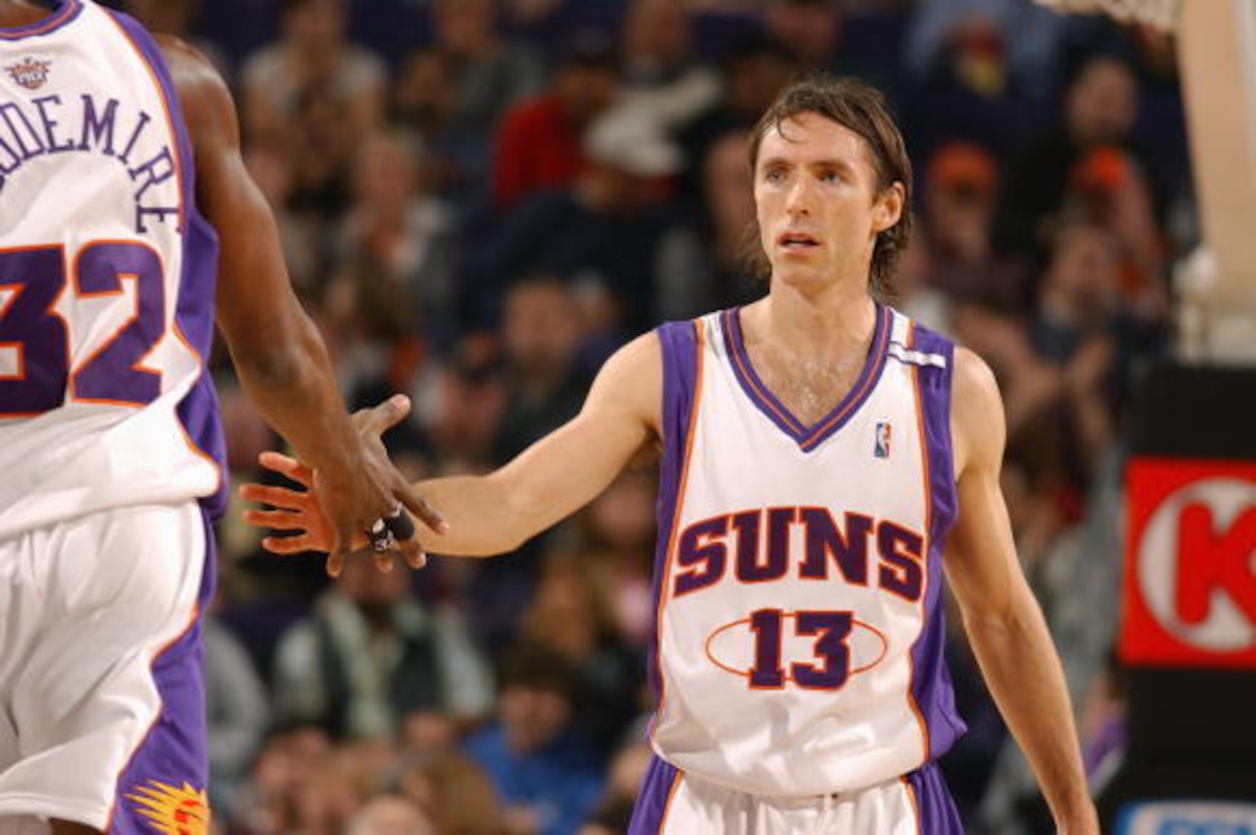 PHOENIX - DECEMBER 7:  Steve Nash #13 and Amare Stoudemire #32 of the Phoenix Suns greet each other while facing the Golden State Warriors on December 7, 2004 at America West Arena in Phoenix, Arizona.  The Suns won 118-104. NOTE TO USER: User expressly a