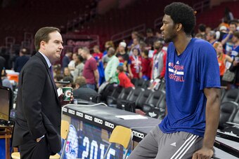 PHILADELPHIA, PA - APRIL 13: Philadelphia 76ers General Manager Sam Hinkie talks to Joel Embiid #21 prior to the game against the Milwaukee Bucks on April 13, 2015 at the Wells Fargo Center in Philadelphia, Pennsylvania. NOTE TO USER: User expressly ackno