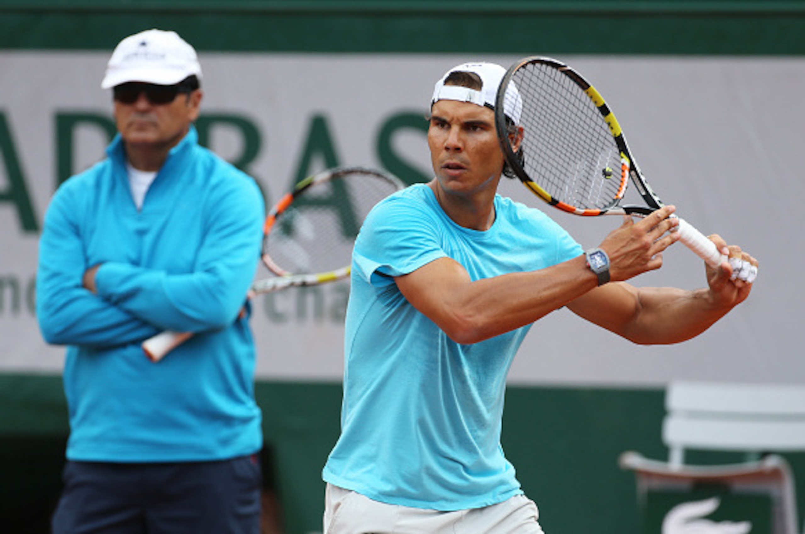 PARIS, FRANCE - MAY 22: Rafael Nadal of Spain is practicing while his coach/uncle Toni Nadal looks on prior to the French Open 2015 at Roland Garros stadium on May 22, 2015 in Paris, France. (Photo by Jean Catuffe/Getty Images) PARIS, FRANCE - MAY 22: Rafael Nadal of Spain is practicing while his coach/uncle Toni Nadal looks on prior to the French Open 2015 at Roland Garros stadium on May 22, 2015 in Paris, France. (Photo by Jean Catuffe/Getty Images)
