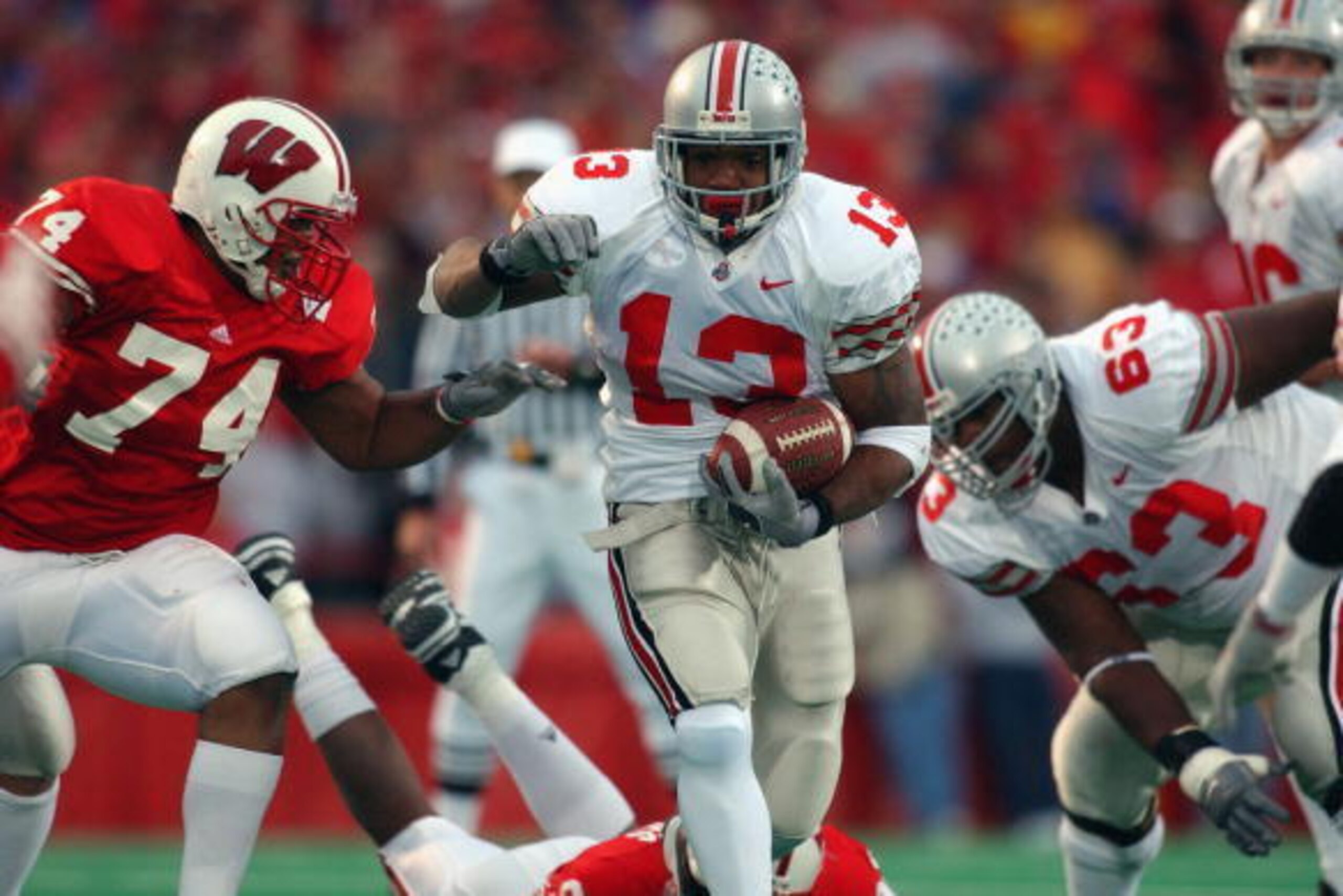 MADISON, WI - OCTOBER 19:  Running back Maurice Clarett #13 of the Ohio State Buckeyes runs with the ball during the Big Ten Conference football game against the Wisconsin Badgers at Camp Randall Stadium on October 19, 2002 in Madison, Wisconsin.  The Buc