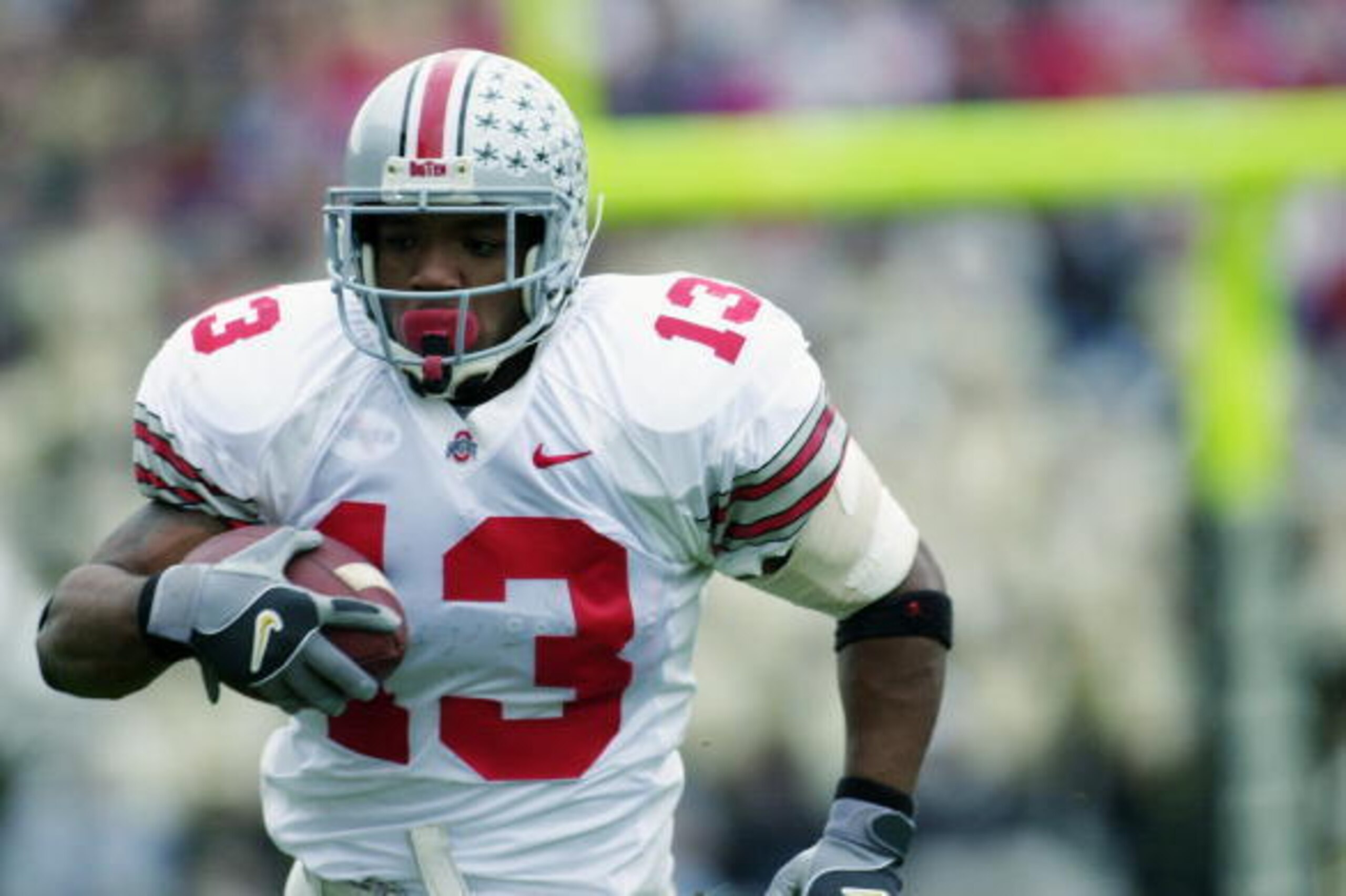 WEST LAFAYETTE, IN - NOVEMBER 9:  Tailback Maurice Clarett #13 of the Ohio State University Buckeyes carries the ball against the Purdue University Boilermakers during the game at Ross-Ade Stadium at Purdue University on November 9, 2002 in West Lafayette