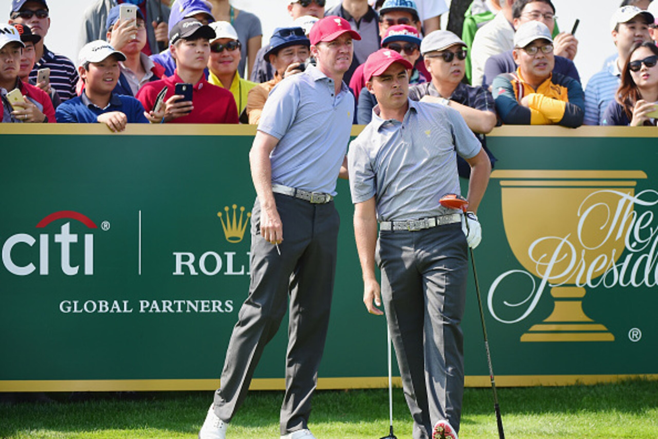 INCHEON CITY, SOUTH KOREA - OCTOBER 06:  Rickie Fowler and Jimmy Walker of the United States team react to a tee shot on the ninth hole prior to the start of The Presidents Cup at the Jack Nicklaus Golf Club on October 6, 2015 in  Incheon City, South Kore