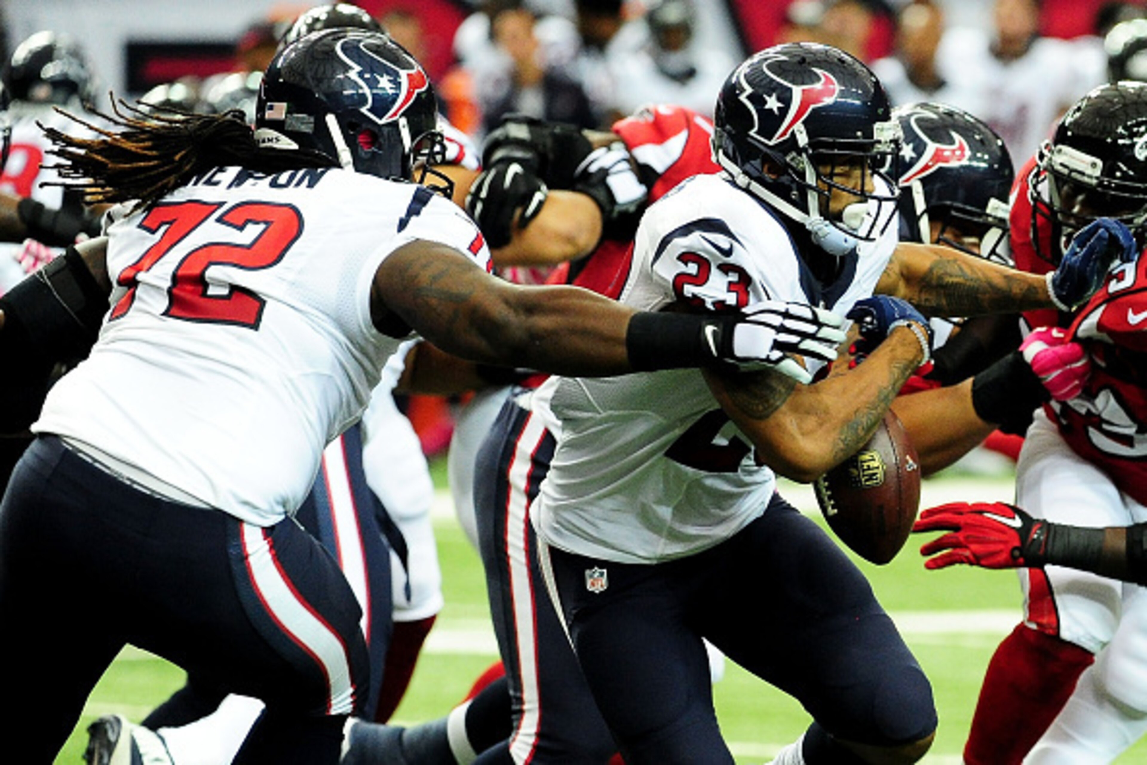 ATLANTA, GA - OCTOBER 04: Arian Foster #23 is forced to fumble by Derek Newton #72 of the Houston Texans in the first half against the Atlanta Falcons at the Georgia Dome on October 4, 2015 in Atlanta, Georgia.  (Photo by Scott Cunningham/Getty Images)