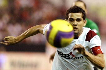 Sevilla's Brazilian Dani Alves runs for the ball during a Spanish league derby football match against Betis at the Sanchez Pizjuan stadium in Sevilla, 06 January 2008. AFP PHOTO/CRISTINA QUICLER (Photo credit should read CRISTINA QUICLER/AFP/Getty Images)