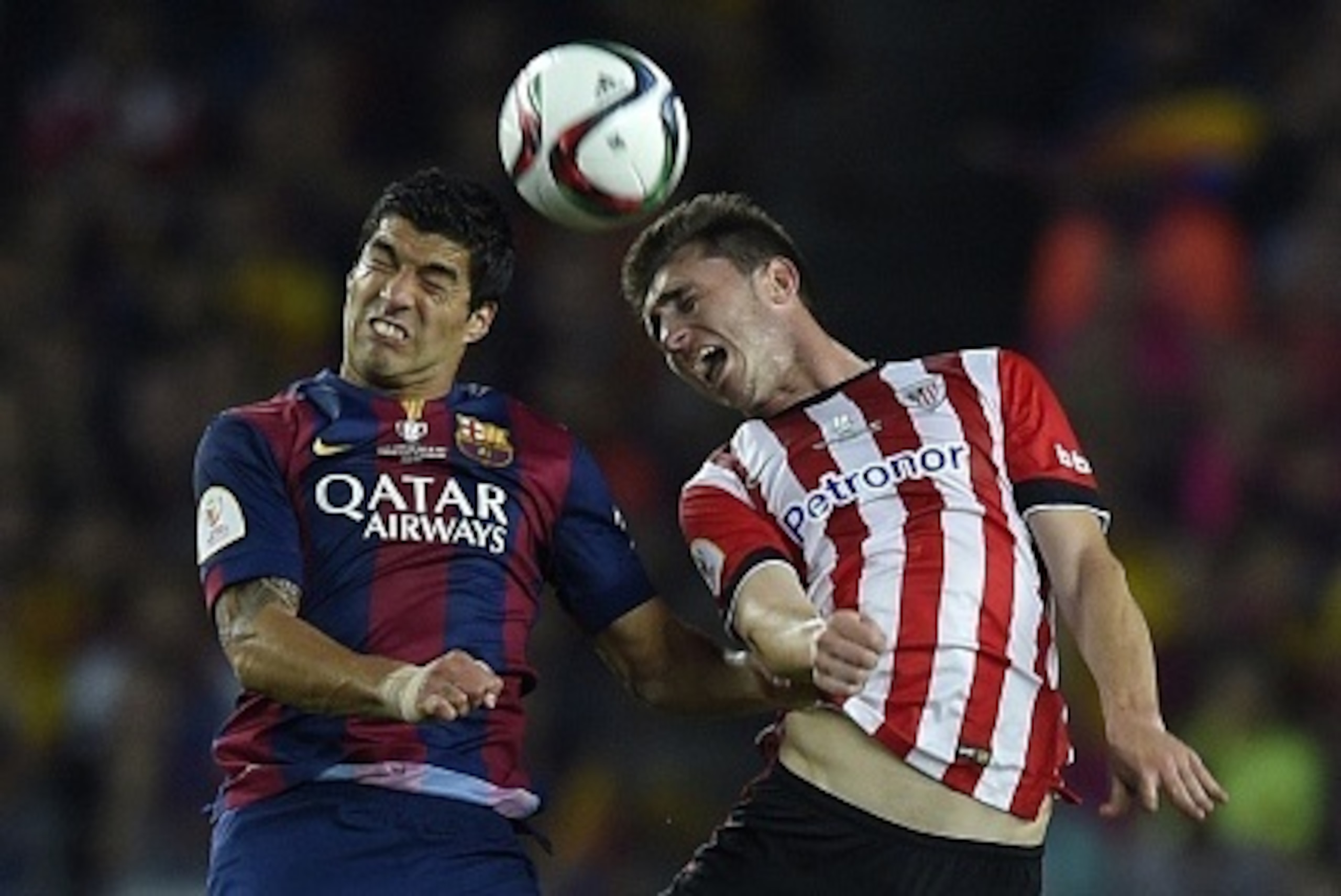 Barcelona's Uruguayan forward Luis Suarez (L) vies with Athletic Bilbao's French defender Aymeric Laporte (R) during the Spanish Copa del Rey (King's Cup) final football match Athletic Club Bilbao vs FC Barcelona at the Camp Nou stadium in Barcelona on Ma