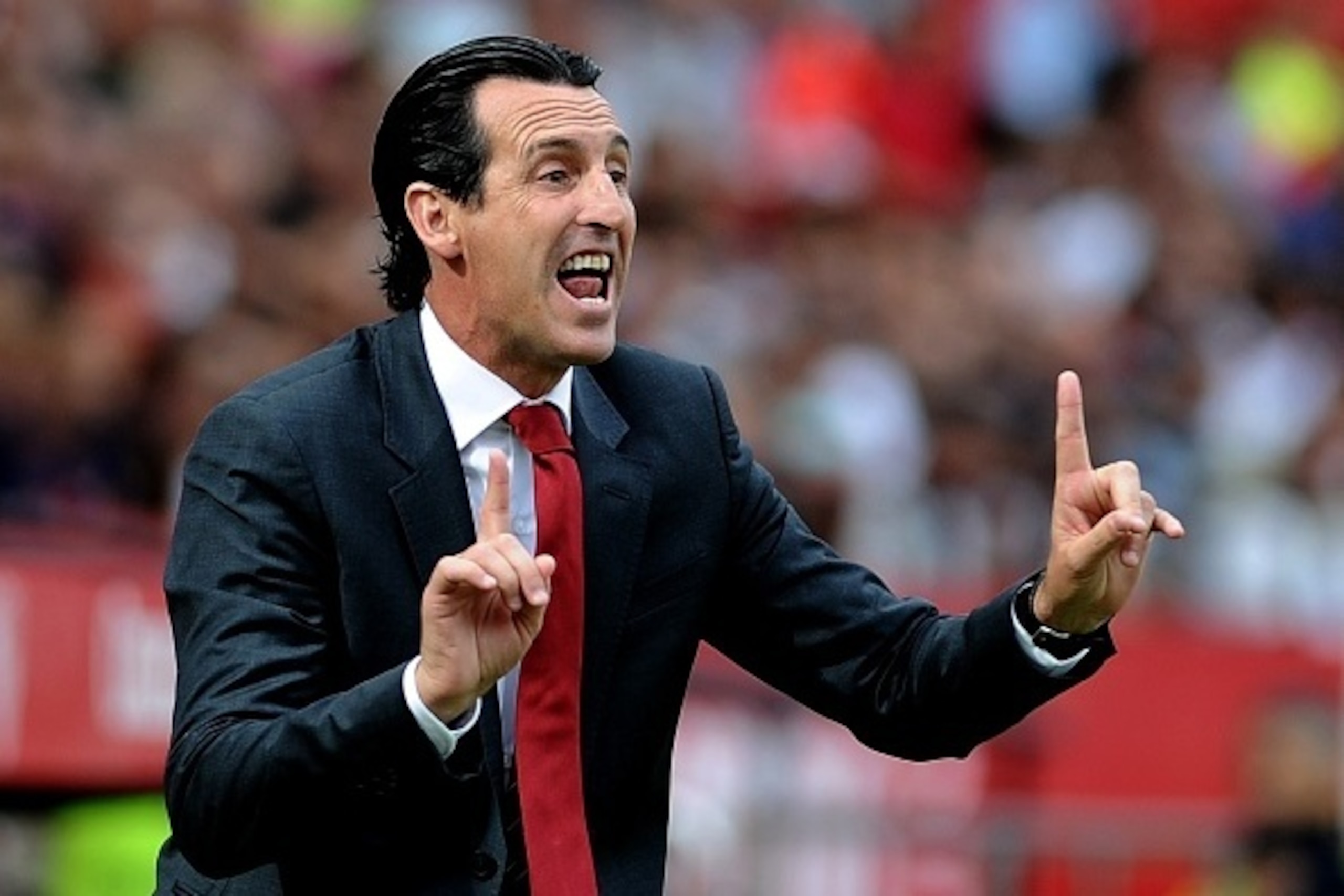 Sevilla's coach Unai Emery gestures during the Spanish league football match Sevilla FC vs Barcelona at the Ramon Sanchez Pizjuan stadium in Sevilla on October 3, 2015.   AFP PHOTO/ CRISTINA QUICLER        (Photo credit should read CRISTINA QUICLER/AFP/Ge