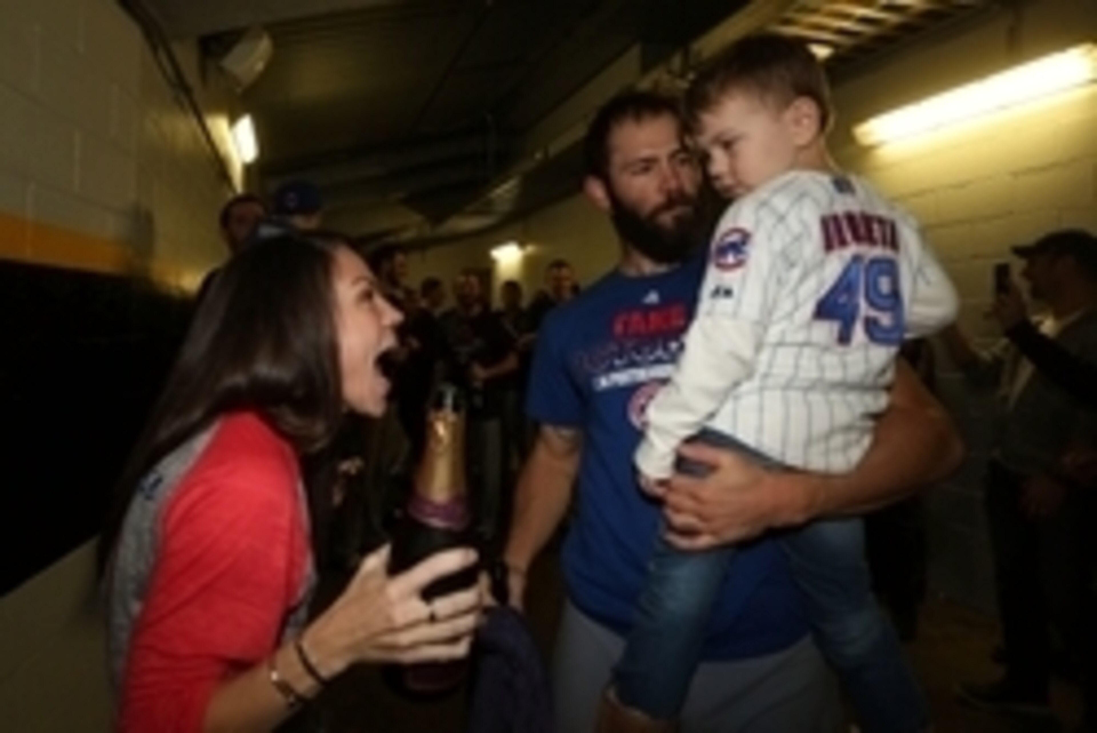 Oct 7, 2015; Pittsburgh, PA, USA; Chicago Cubs starting pitcher Jake Arrieta celebrates with his son Cooper and wife Brittany Arrieta after defeating the Pittsburgh Pirates in the National League Wild Card playoff baseball game at PNC Park. Cubs won 4-0. 