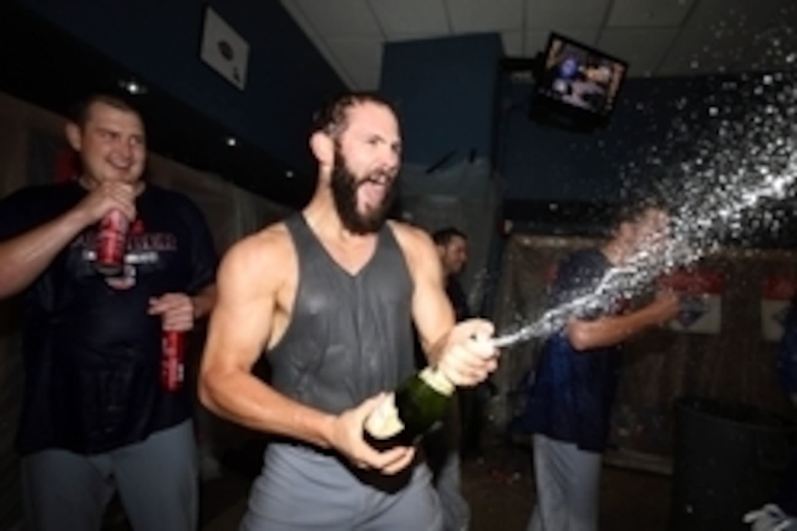 Oct 7, 2015; Pittsburgh, PA, USA; Chicago Cubs starting pitcher Jake Arrieta (49) celebrates in the locker room after defeating the Pittsburgh Pirates in the National League Wild Card playoff baseball game at PNC Park. Cubs won 4-0. Mandatory Credit: Char