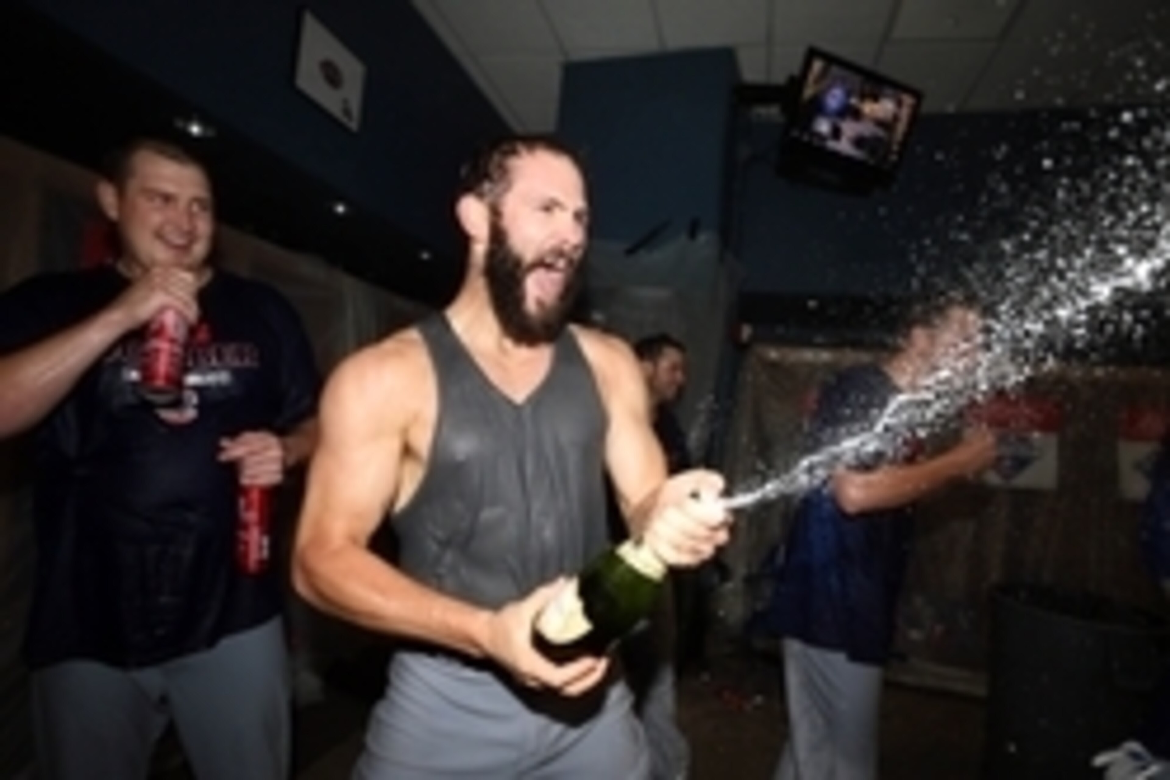 Oct 7, 2015; Pittsburgh, PA, USA; Chicago Cubs starting pitcher Jake Arrieta (49) celebrates in the locker room after defeating the Pittsburgh Pirates in the National League Wild Card playoff baseball game at PNC Park. Cubs won 4-0. Mandatory Credit: Char