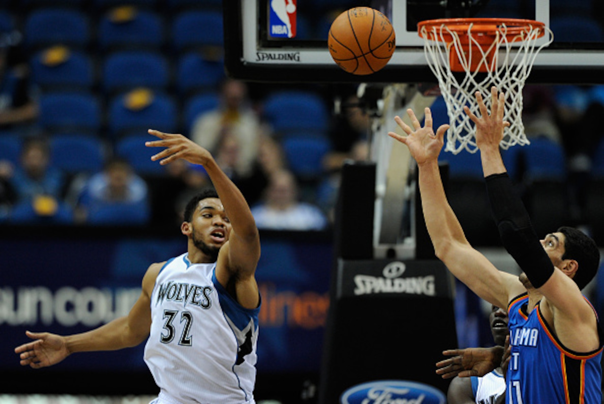 MINNEAPOLIS, MN - OCTOBER 7: Karl-Anthony Towns #32 of the Minnesota Timberwolves and Enes Kanter #11 of the Oklahoma City Thunder go up for a rebound during the third quarter of the preseason game on October 7, 2015 at Target Center in Minneapolis, Minne